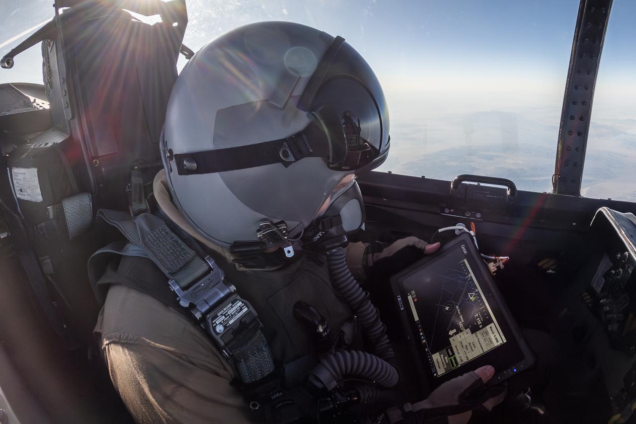 NASA photographer James Ross monitors the Airborne Location Integrating Geospatial Navigation System (ALIGNS) from the backseat of an F-15 near NASA’s Armstrong Flight Research Center in Edwards, California. The ALIGNS provides real-time positioning guidance between aircraft for shock wave probing and schlieren imagery capture.
