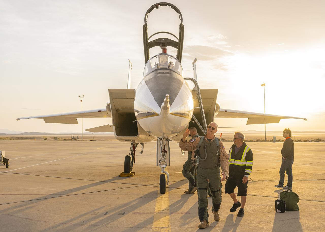 NASA test pilot Nils Larson walks around an F-15B research aircraft for a rehearsal flight supporting the agency’s Quesst mission at NASA’s Armstrong Flight Research Center in Edwards, California. The flight was part of a full-scale dress rehearsal for Phase 2 of the mission, which will eventually measure quiet sonic thumps generated by the X-59. The flight series helped NASA teams refine procedures and practice data collection ahead of future X-59 flights.