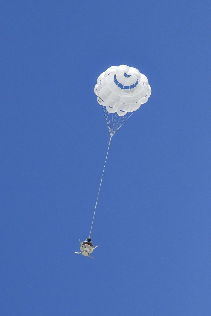 The parachute of the Enhancing Parachutes by Instrumenting the Canopy test experiment deploys following an air launch from an Alta X drone on June 4, 2025, at NASA’s Armstong Flight Research Center in Edwards, California. NASA researchers are developing technology to make supersonic parachutes safer and more reliable for delivering science instruments and payloads to Mars.
