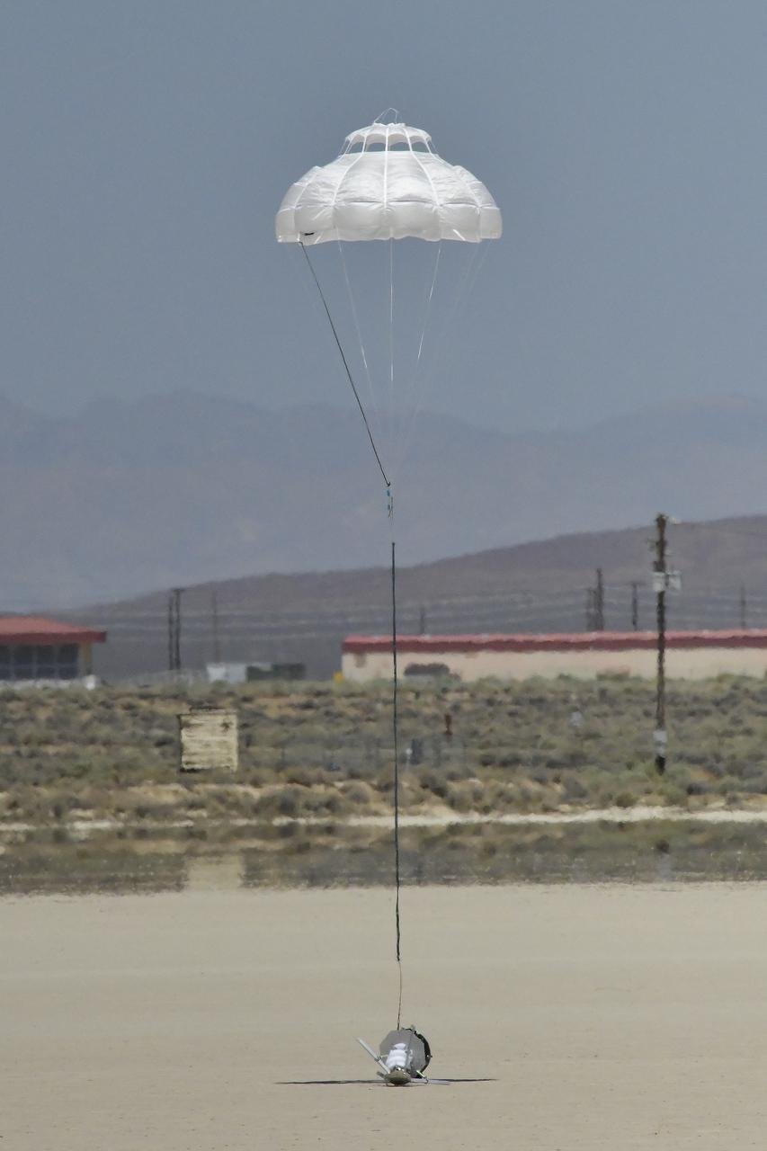 The Enhancing Parachutes by Instrumenting the Canopy test experiment lands following an air launch from an Alta X drone on June 4, 2025, at NASA’s Armstong Flight Research Center in Edwards, California. NASA researchers are developing technology to make supersonic parachutes safer and more reliable for delivering science instruments and payloads to Mars.