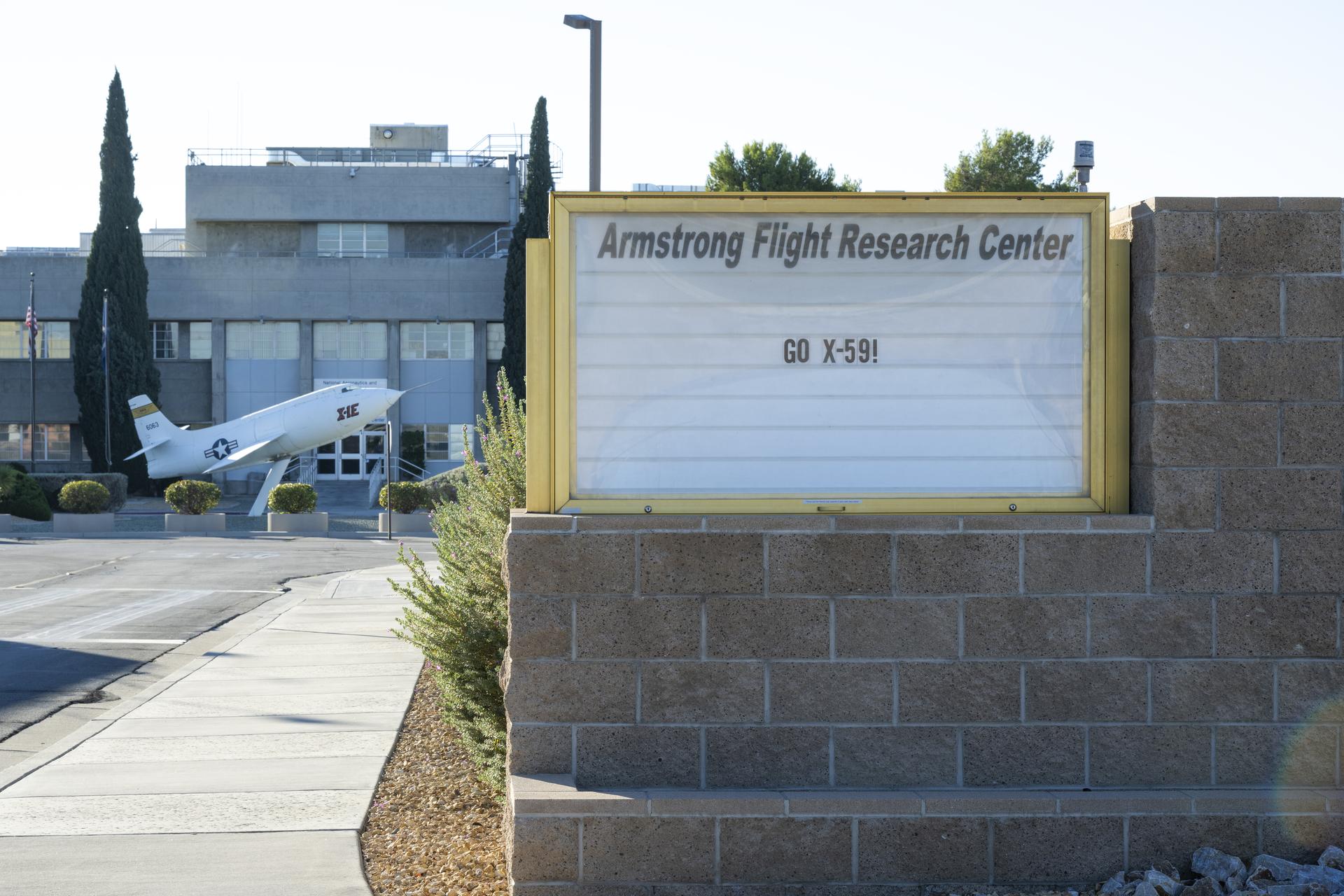 A sign at NASA’s Armstrong Flight Research Center in Edwards, California, reads “GO X-59” ahead of the agency’s quiet supersonic research aircraft’s first flight on Tuesday, Oct. 28, 2025. The X-59 departed from Lockheed Martin’s Skunk Works facility and landed at Edwards Air Force Base after a 67-minute flight, then taxied to Armstrong, completing its historic first flight.