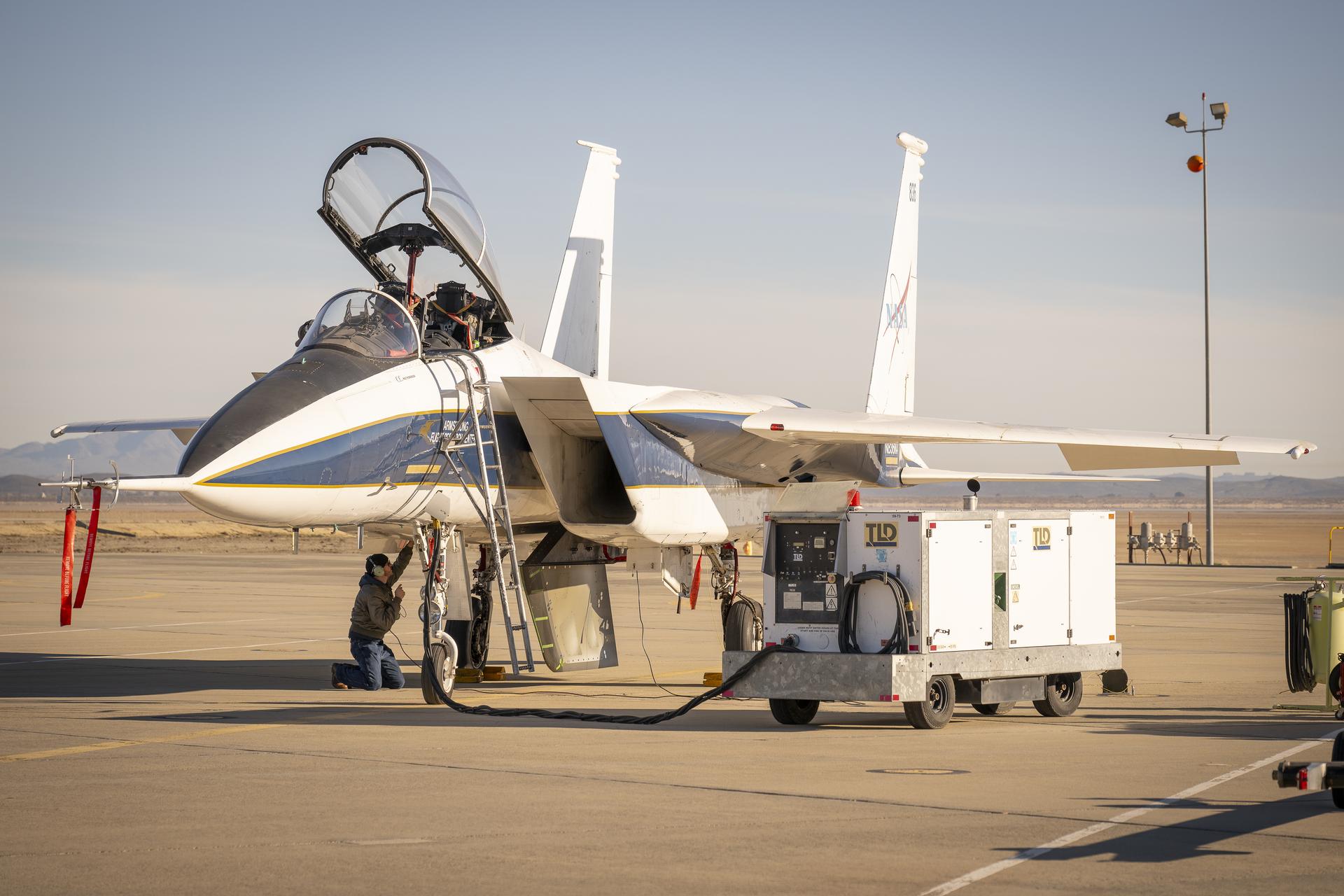 NASA ground crew prepares the agency’s F-15 research aircraft and Cross Flow Attenuated Natural Laminar Flow (CATNLF) test article ahead of its first high-speed taxi test on Tuesday, Jan. 12, 2026, at NASA’s Armstrong Flight Research Center in Edwards, California. The CATNLF design aims to reduce drag on wing surfaces to improve efficiency and, in turn, reduce fuel burn.