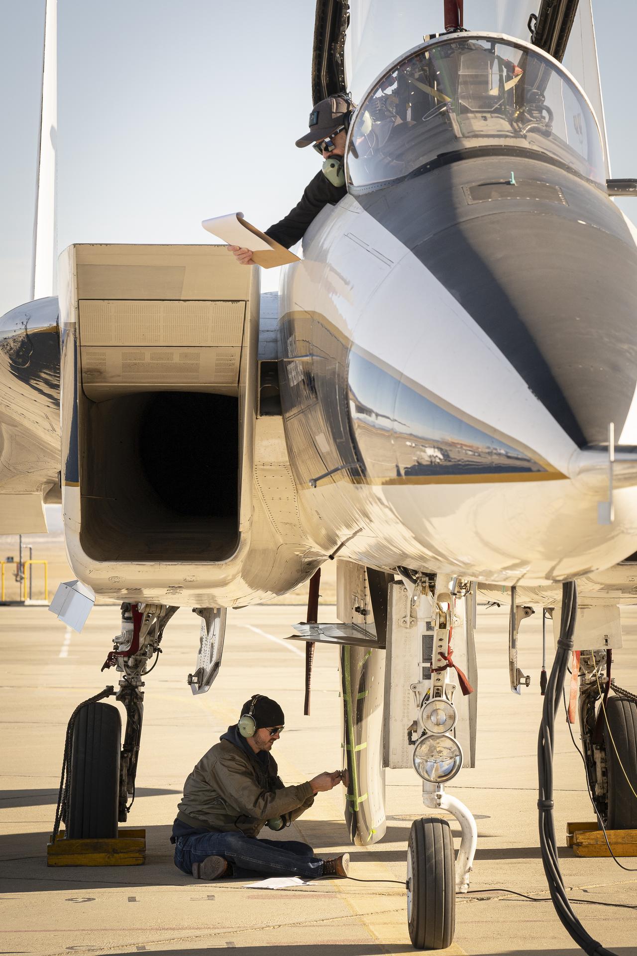 NASA ground crew prepares the agency’s F-15 research aircraft and Cross Flow Attenuated Natural Laminar Flow (CATNLF) test article ahead of its first high-speed taxi test on Tuesday, Jan. 12, 2026, at NASA’s Armstrong Flight Research Center in Edwards, California. The CATNLF design aims to reduce drag on wing surfaces to improve efficiency and, in turn, reduce fuel burn.