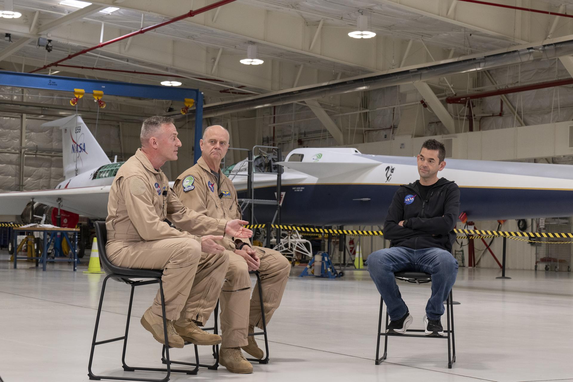 NASA Administrator Jared Isaacman, right, speaks with NASA X-59 pilots Jim “Clue” Less, left, and Nils Larson during Isaacman’s visit to NASA’s Armstrong Flight Research Center in Edwards, California, on Sunday, Jan. 25, 2026. Isaacman, NASA’s 15th administrator, began visiting the agency’s centers after his appointment on Dec. 17, 2025.