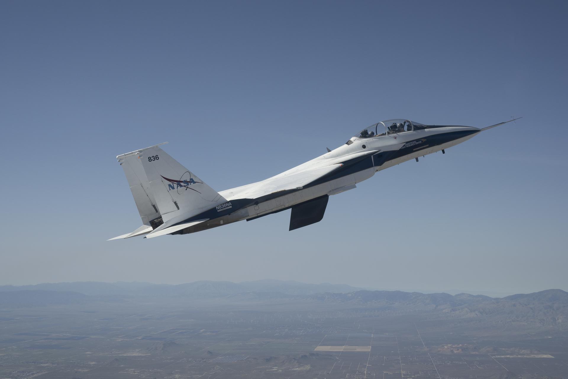 NASA’s Crossflow Attenuated Natural Laminar Flow (CATNLF) scale-model wing flies for the first time on a NASA F-15 research jet during a test flight from NASA’s Armstrong Flight Research Center in Edwards, California. The 75-minute flight confirmed the aircraft could maneuver safely with the approximately 3-foot-tall test article mounted beneath it. NASA will continue flight tests to collect data that validates the CATNLF design and its potential to improve laminar flow, reducing drag and lowering fuel costs for future commercial aircraft. 