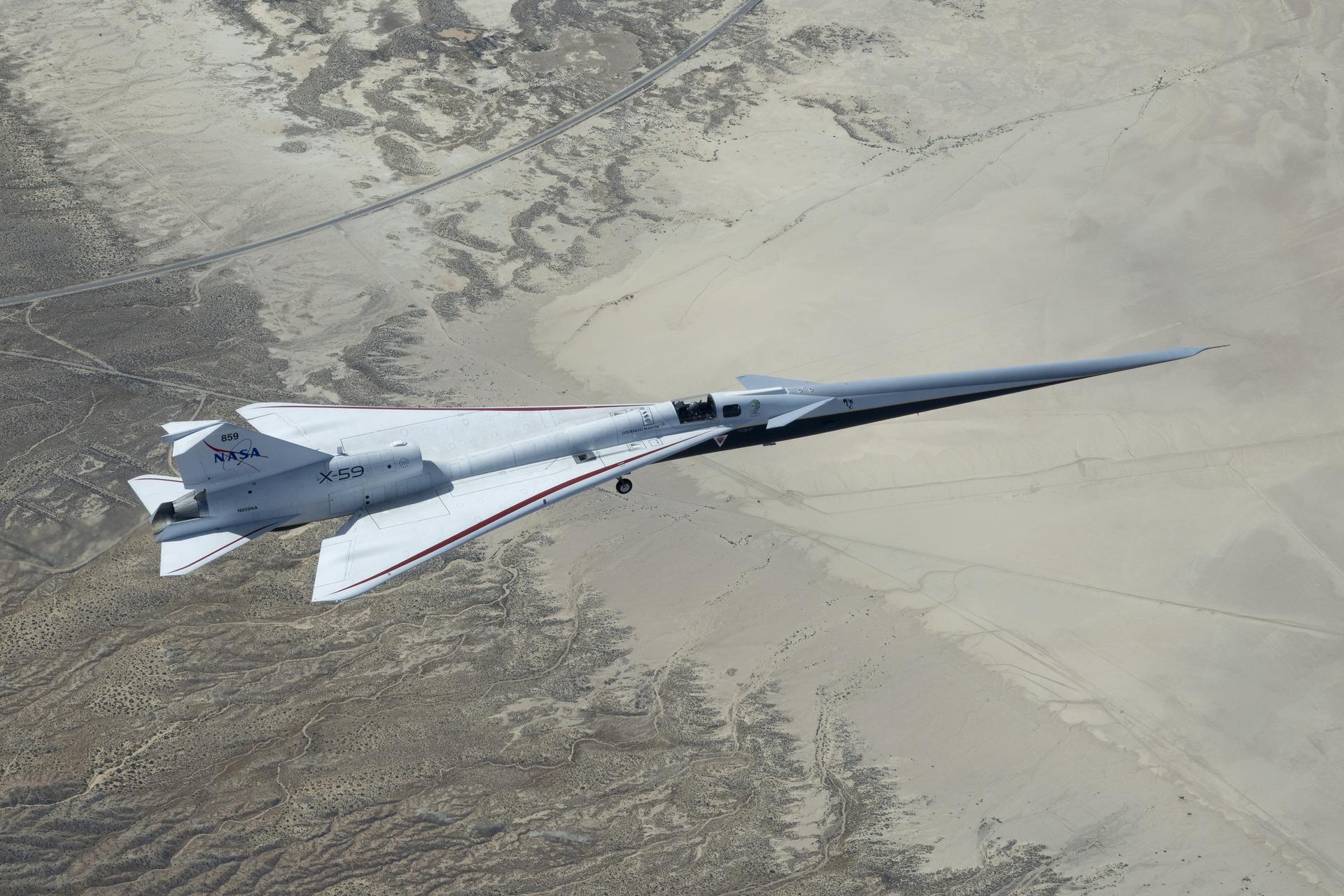 NASA’s X-59 quiet supersonic jet flies over the Mojave Desert during its third flight on Thursday, March 26, 2026, from NASA’s Armstrong Flight Research Center in Edwards, California. The aircraft departed and landed at Edwards Air Force Base, completing its approximate one-hour flight and providing the team with significant data for future flights.