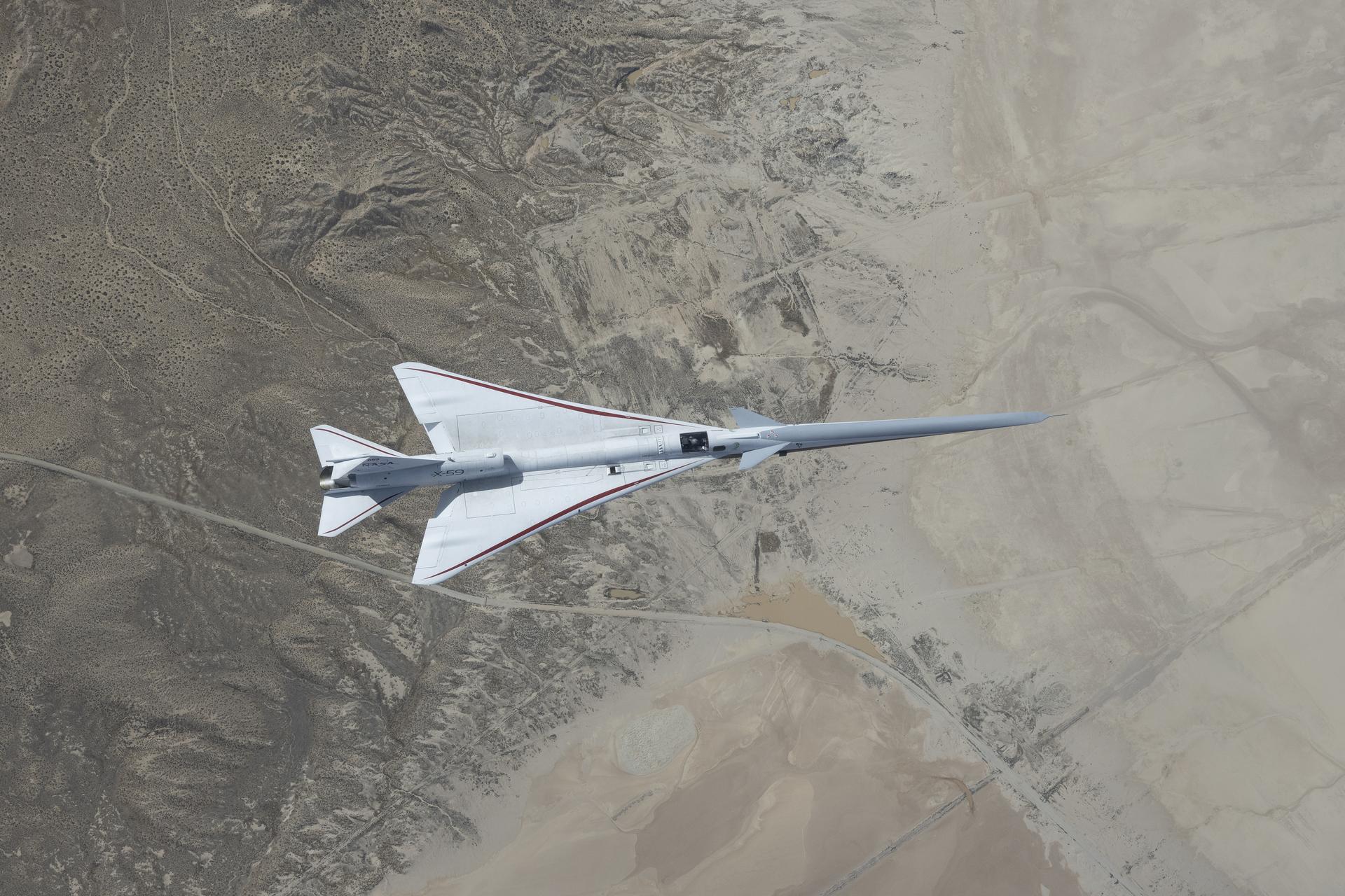 NASA’s X-59 quiet supersonic jet flies over the Mojave Desert during its third flight on Thursday, March 26, 2026, from NASA’s Armstrong Flight Research Center in Edwards, California. The aircraft departed and landed at Edwards Air Force Base, completing its approximate one-hour flight and providing the team with significant data for future flights.
