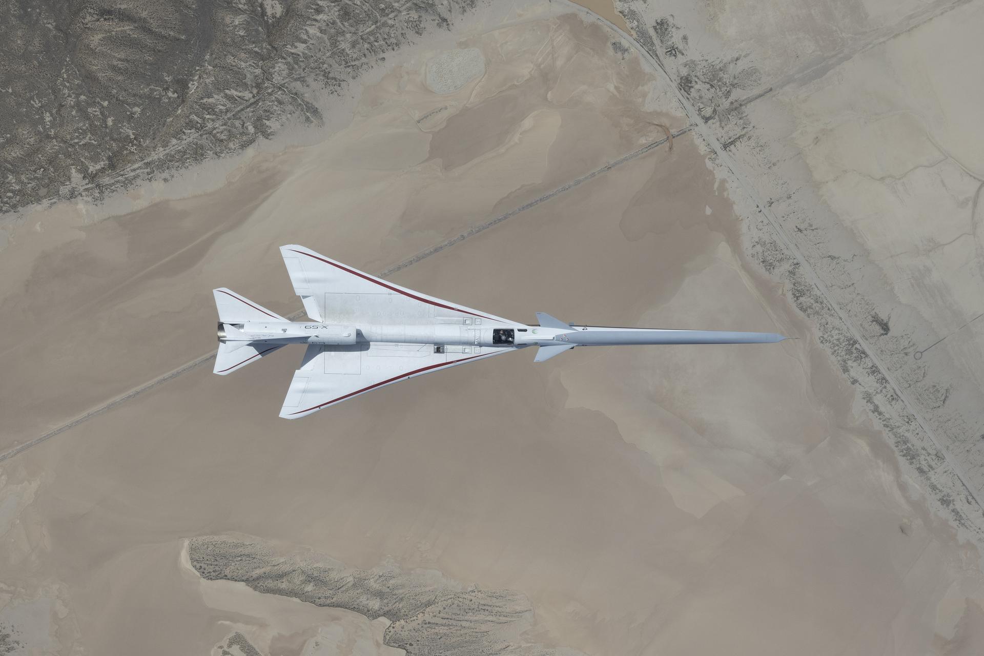 NASA’s X-59 quiet supersonic jet flies over the Mojave Desert during its third flight on Thursday, March 26, 2026, from NASA’s Armstrong Flight Research Center in Edwards, California. The aircraft departed and landed at Edwards Air Force Base, completing its approximate one-hour flight and providing the team with significant data for future flights.