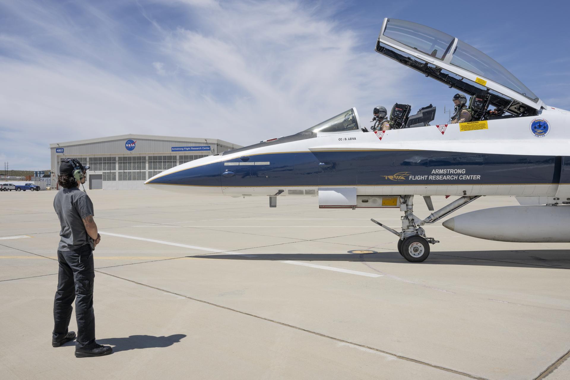 Crew chief, David Leiva, prepares NASA pilot Jim Less and Mike Frederick, aerospace engineer and researcher, for an employee incentive flight in an F/A-18 aircraft at NASA’s Armstrong Flight Research Center in Edwards, California, on Wednesday, April 15, 2026. NASA Administrator Jared Isaacman established the ride‑along program to recognize and reward workforce members for their dedication to advancing the agency’s priorities.