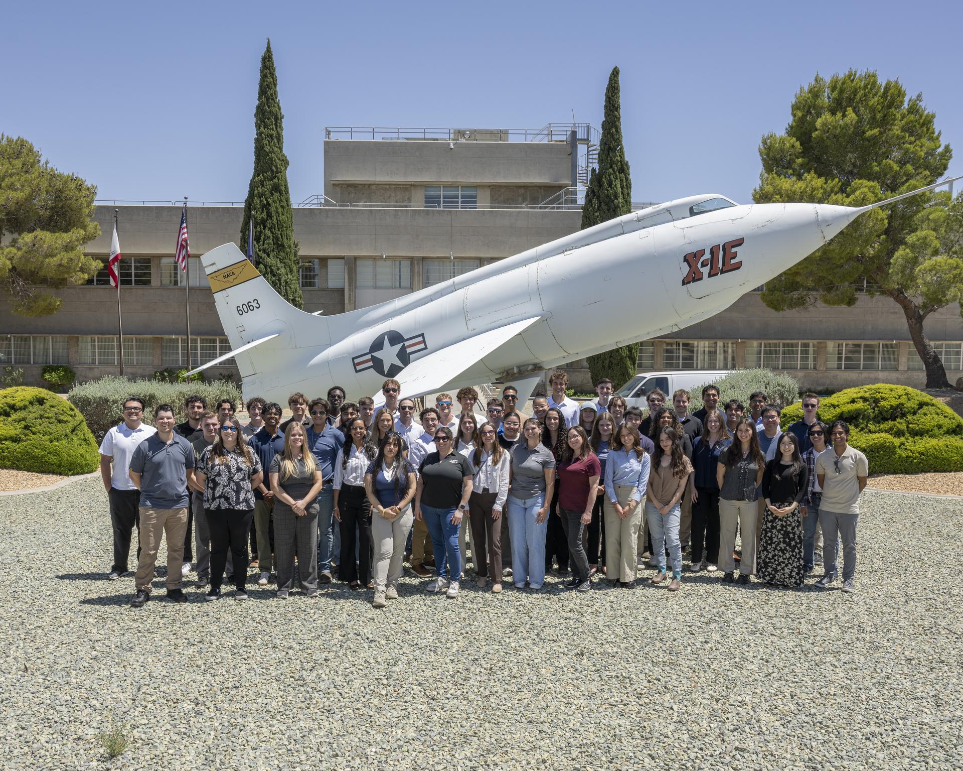  NASA 2026 summer interns gather in front of the historic X-1E aircraft at NASA’s Armstrong Flight Research Center in Edwards, California, on Monday, June 1, 2026. NASA’s internships aim to inspire the Artemis Generation to pursue STEM careers across the nation.
