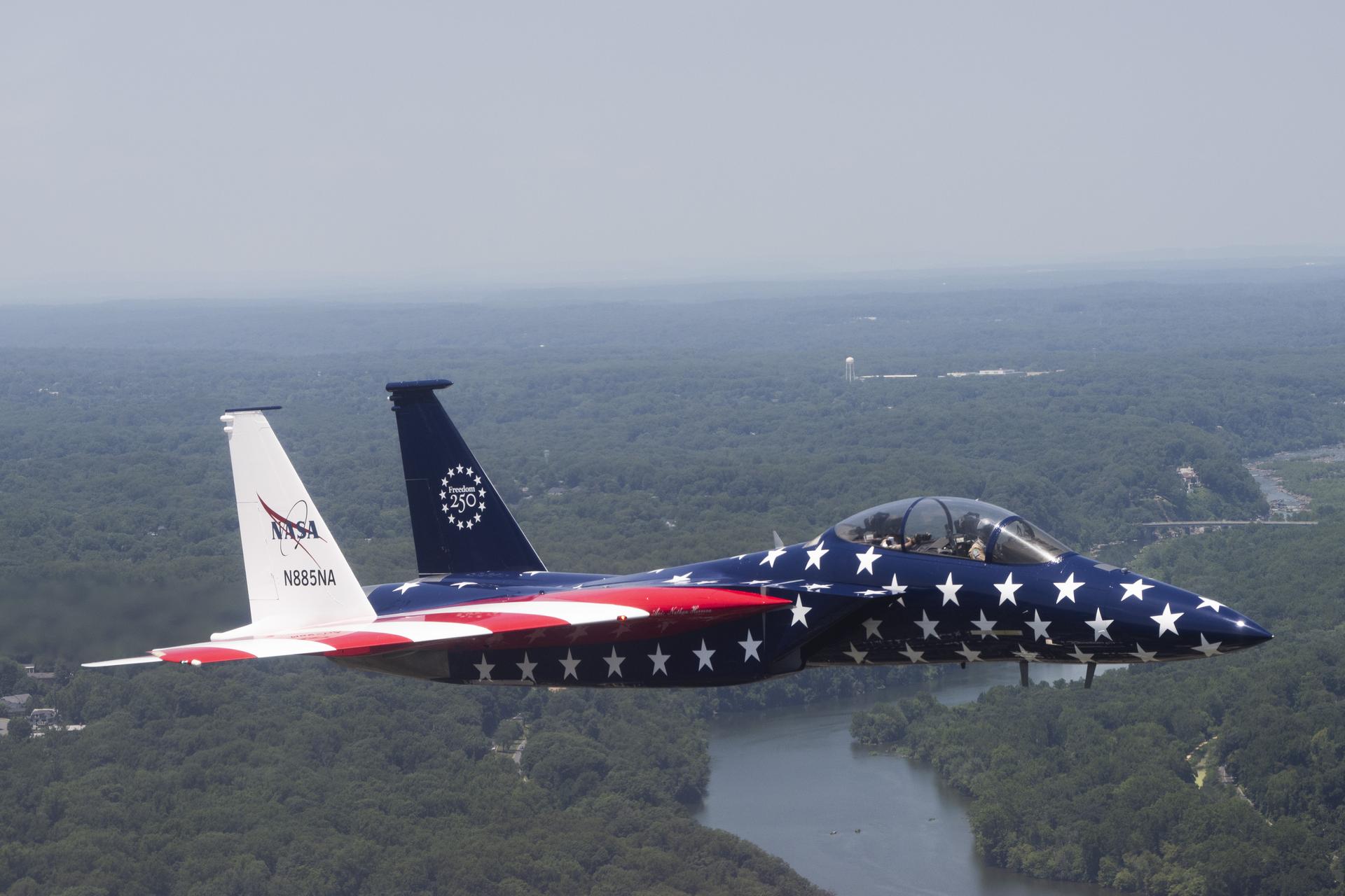 A NASA F-15 aircraft flies above Washington on Saturday, July 4, 2026, as part of a flyover to celebrate America’s 250th birthday. This aircraft is from NASA’s Armstrong Flight Research Center in Edwards, California, and it joined other NASA aircraft for the flyover.