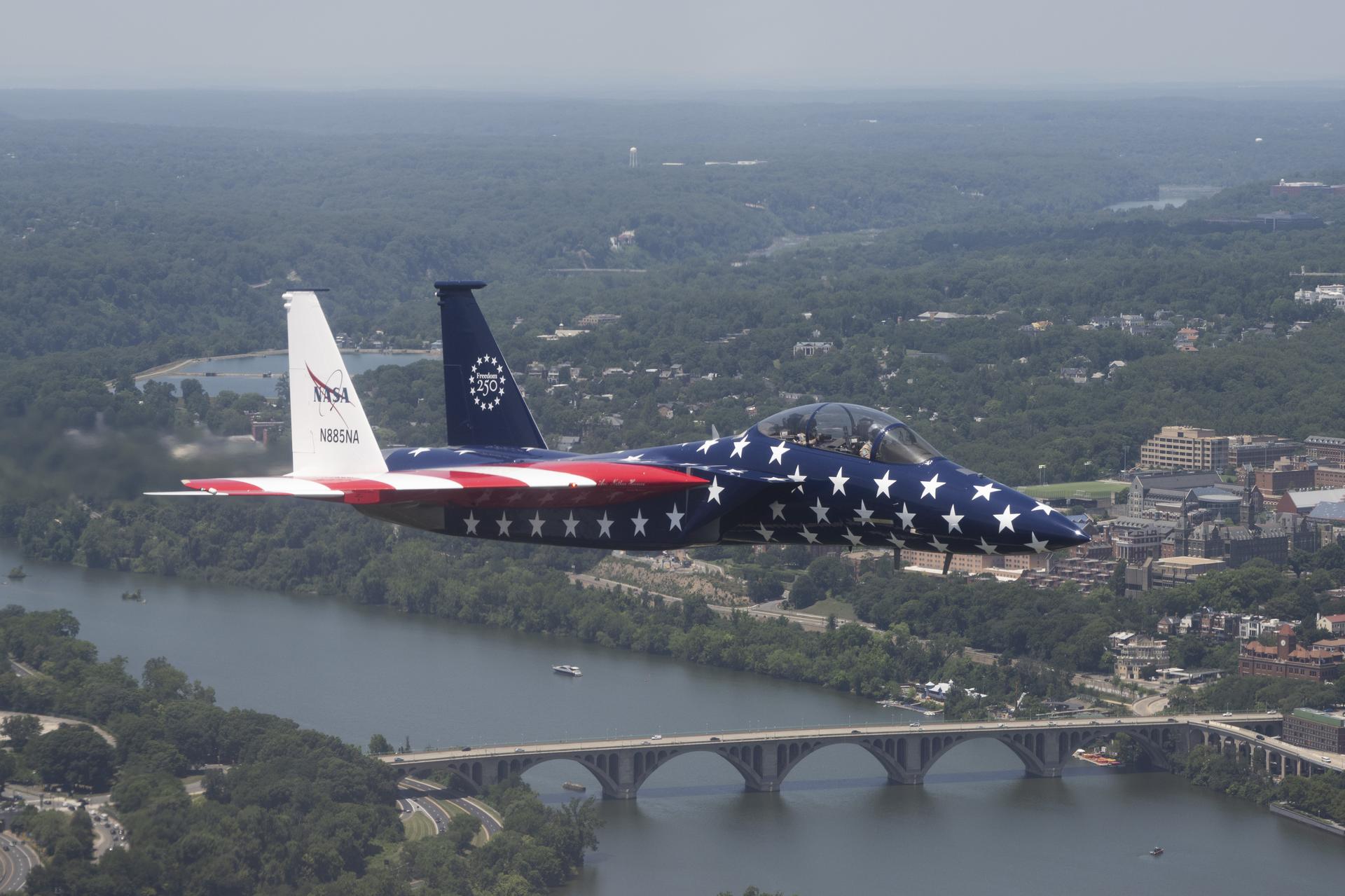 A NASA F-15 aircraft flies above Washington on Saturday, July 4, 2026, as part of a flyover to celebrate America’s 250th birthday. This aircraft is from NASA’s Armstrong Flight Research Center in Edwards, California, and it joined other NASA aircraft for the flyover.
