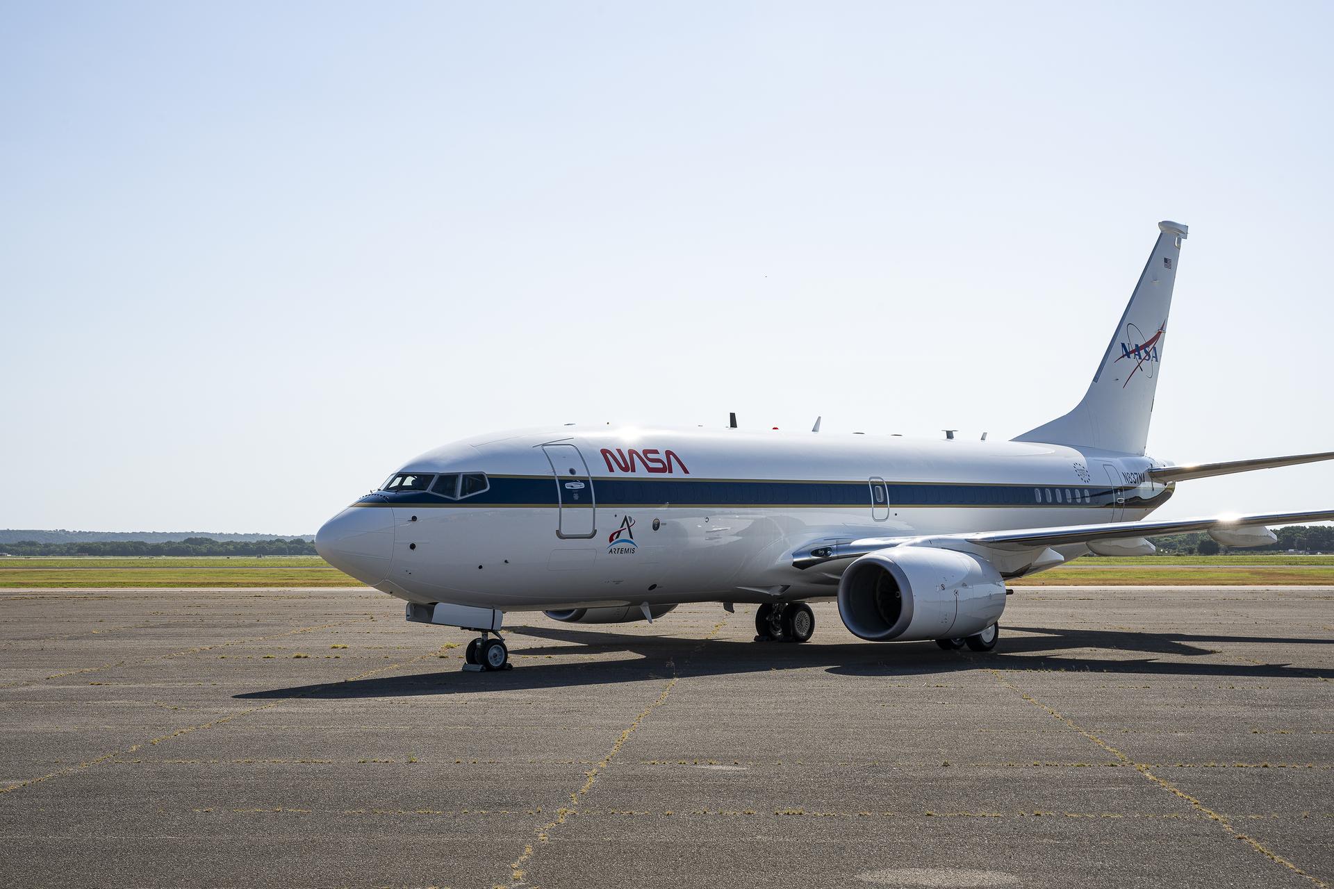 A newly painted NASA 737 aircraft sits on a ramp in Oklahoma on Thursday, Aug. 13, 2026. After modifications, this aircraft will perform lunar-gravity parabolic flights to validate astronaut lunar suits and associated crew systems required to support Artemis mission objectives. Flight testing will happen at NASA’s Johnson Space Center in Houston for reduced-gravity operations, with oversight by NASA’s Armstrong Flight Research Center in Edwards, California. In addition, the aircraft will serve as a key asset for systems‑integration research for flight testing autonomy, sensors, and other digital systems.