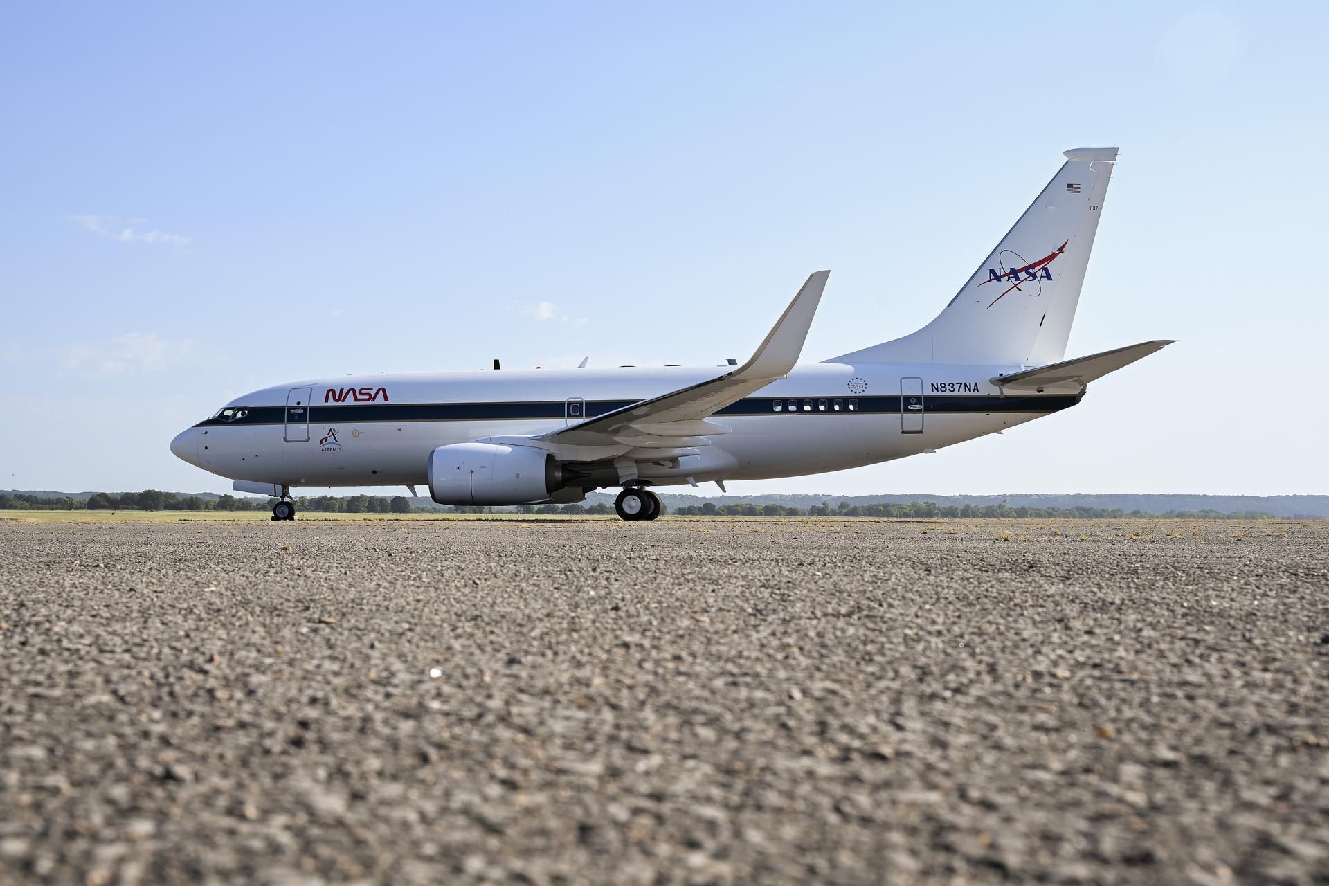 A newly painted NASA 737 aircraft sits on a ramp in Oklahoma on Thursday, Aug. 13, 2026. After modifications, this aircraft will perform lunar-gravity parabolic flights to validate astronaut lunar suits and associated crew systems required to support Artemis mission objectives. Flight testing will happen at NASA’s Johnson Space Center in Houston for reduced-gravity operations, with oversight by NASA’s Armstrong Flight Research Center in Edwards, California. In addition, the aircraft will serve as a key asset for systems‑integration research for flight testing autonomy, sensors, and other digital systems.