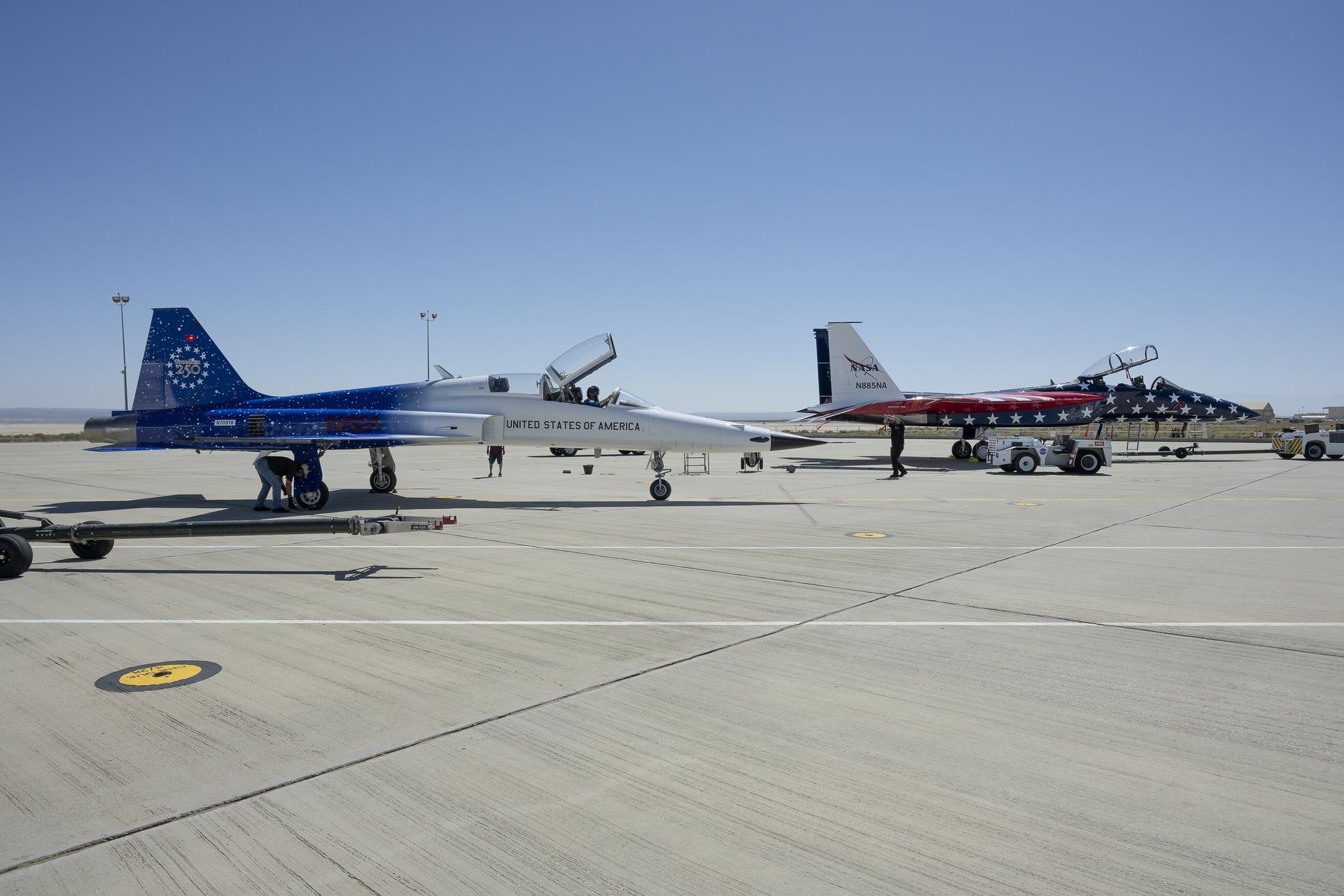 A Northrop F-5 Tiger II and NASA’s F-15 prepare for Red, White, and Boom, the U.S. Air Force Test Center’s celebration of America’s 250th anniversary and NASA Armstrong’s commemoration of its 80th year, at NASA’s Armstrong Flight Research Center in Edwards, California, on Thursday, Sept. 17, 2026. The event brought together the workforce, families, and the Edwards community for a high‑energy day featuring a Flightline 5K, Ramp Fest and STEM Expo, static aircraft displays, hands‑on STEM activities, and a NASA flyover with sonic boom.