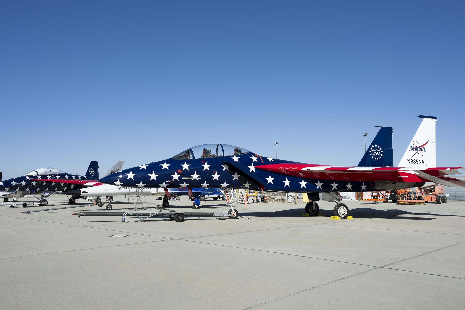 NASA’s F/A-18, a Northrop F-5 Tiger II, and NASA’s F-15 are on static display at Red, White, and Boom, the U.S. Air Force Test Center’s celebration of America’s 250th anniversary and NASA Armstrong’s commemoration of its 80th year at Edwards Air Force Base, California, on Friday, Sept. 18, 2026. The event brought together the workforce, families, and the Edwards community for a high‑energy day featuring a Flightline 5K, Ramp Fest and STEM Expo, static aircraft displays, hands‑on STEM activities, and a NASA flyover with sonic boom.