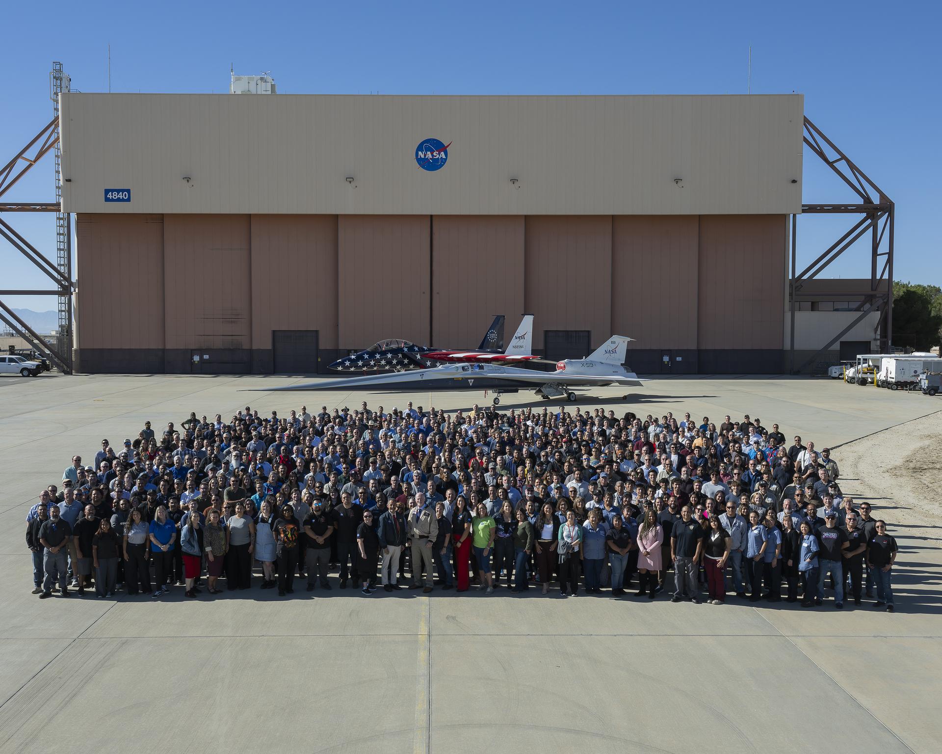 Employees gather for a group photo marking the 80th anniversary of NASA’s Armstrong Flight Research Center in Edwards, California, on Monday, Sept. 28, 2026. For 80 years, NASA Armstrong has supported milestone missions ranging from space shuttle landings to SR-71 flights, shaping the evolution of science, aeronautics, and space research.