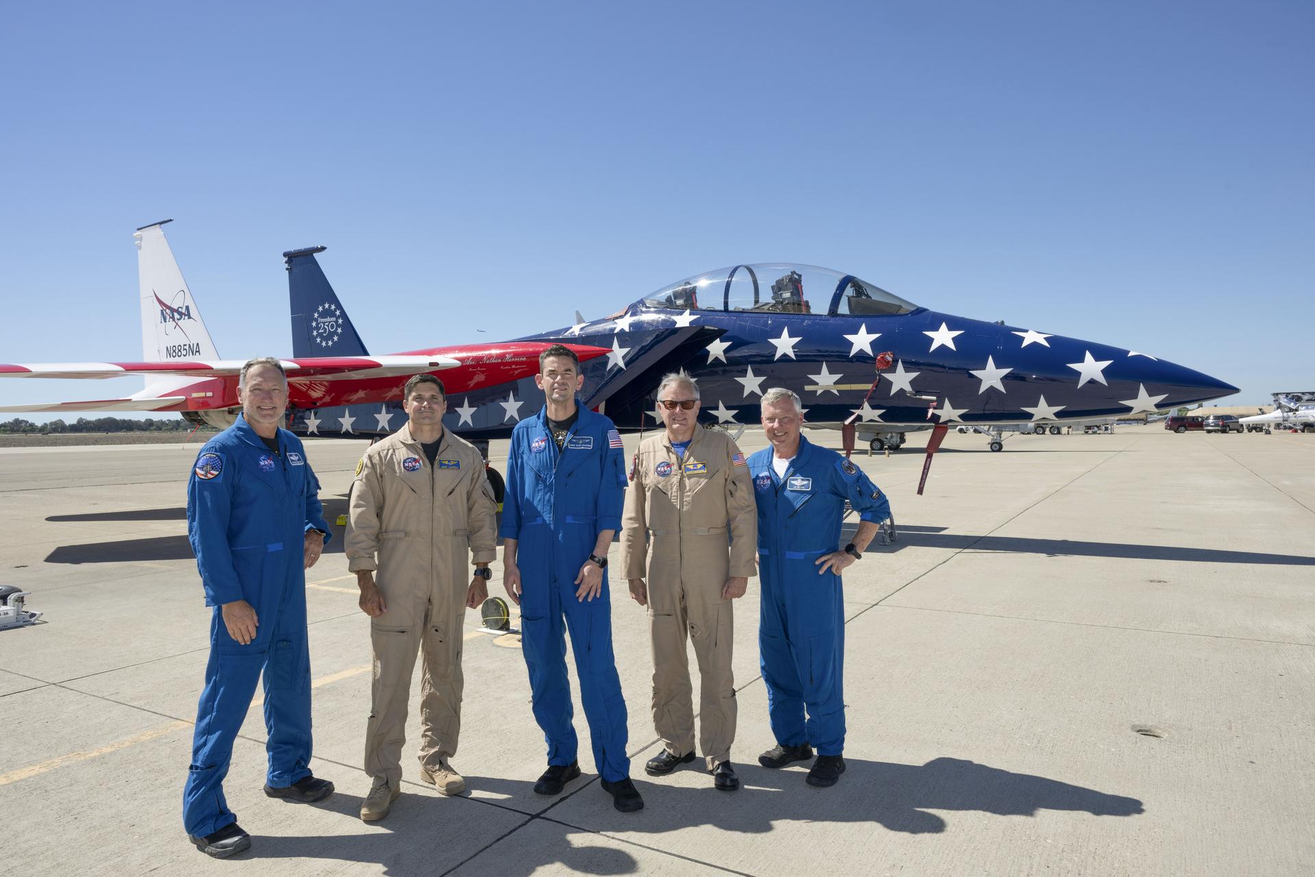 NASA’s 15th Administrator Jared Issacman, center, poses with, from left, Sean Gustafson, senior advisor to the administrator; NASA pilot Mike Lippert; NASA pilot Wayne Ringelberg; and Todd Ericson, senior advisor to the administrator, in front of agency’s newly painted F‑15, which honors America’s 250th birthday, during the Pacific Airshow in Huntington Beach, California, Saturday, Oct. 3, 2026.