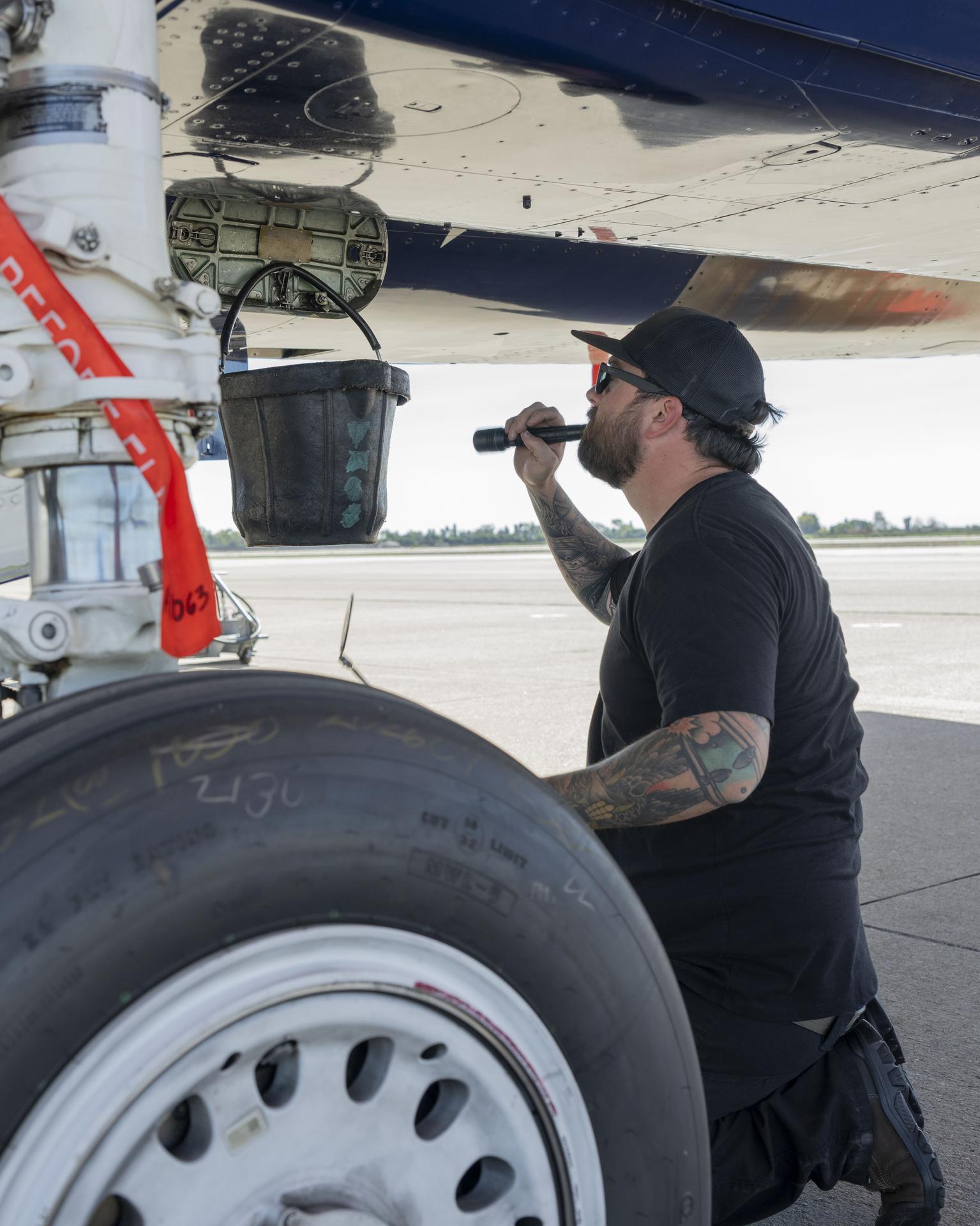 NASA F-15 Crew Chief Zach Burke inspects the aircraft at Los Alamitos Joint Forces Training Base, California, Sunday, Oct. 4, 2026. The jet was among the NASA aircraft that flew in the Pacific Airshow in Huntington Beach, California, Oct. 2-4.