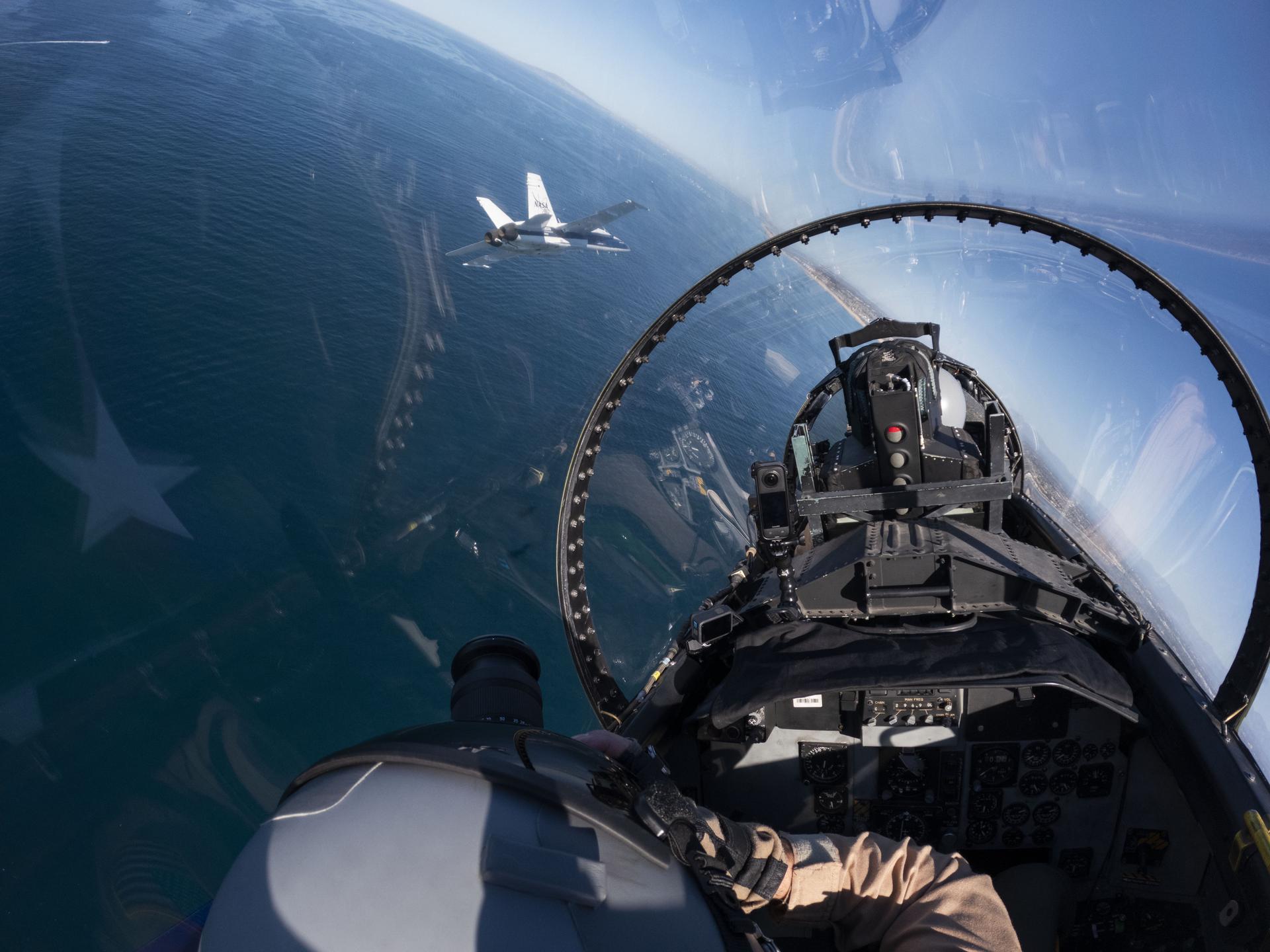 A NASA F/A-18 aircraft is shown flying next to the agency’s newly painted F-15 during the Pacific Airshow in Huntington Beach, California, Sunday, Oct. 4, 2026. The F‑15, from NASA’s Armstrong Flight Research Center in Edwards, California, is painted in honor of America’s 250th birthday.