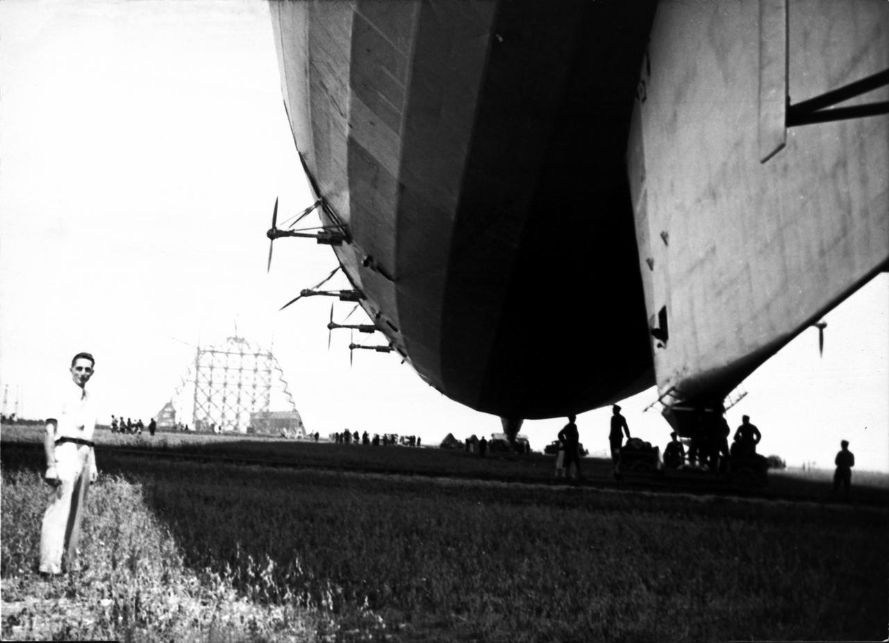 Navy Victor A. Hermann pictured in lower left corner by the USS Akron.  Contruction of first hangar at Moffett Field