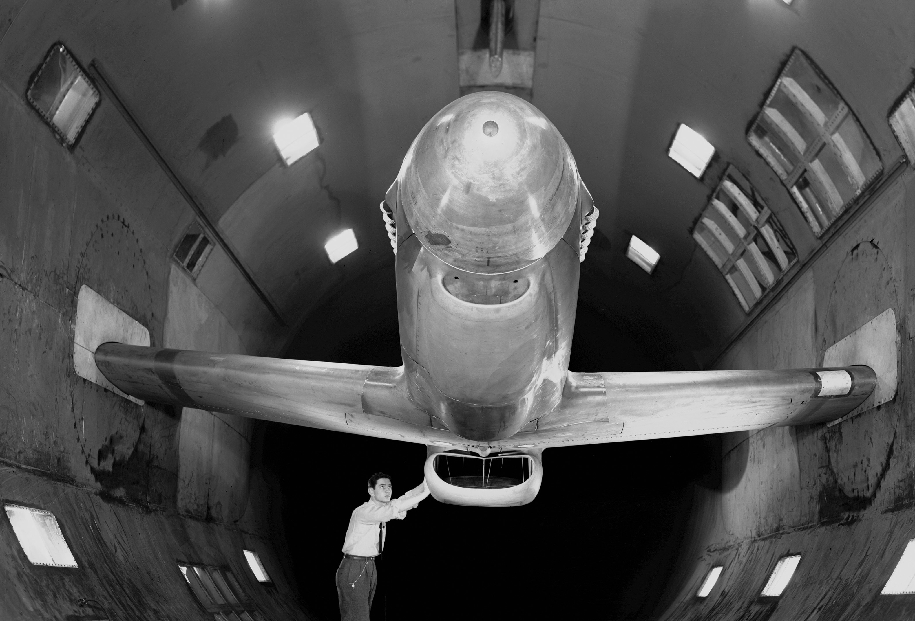 XP-51B airplane in 16ft wind tunnel with test engineer