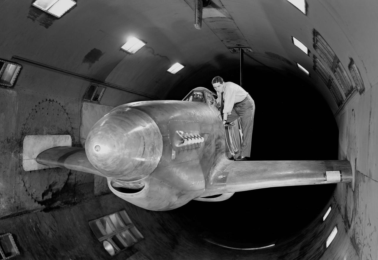 NACA Photographer - North American XP-51B Airplane with outer wing panels removed and ready for testing in Ames 16 foot wind tunnel.