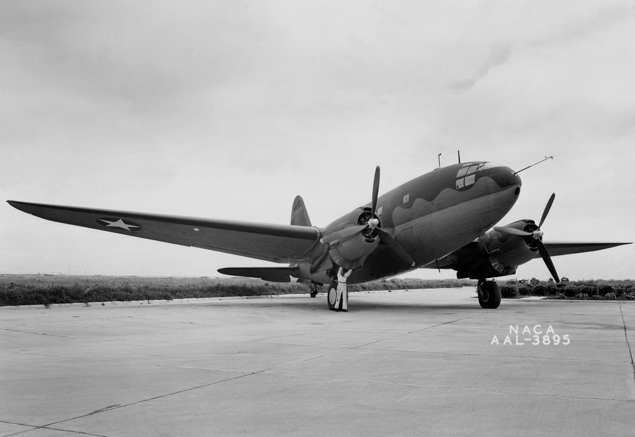 NACA Photographer 3/4 front view Curtiss C-46 airplane in which the thermal ice-prevention equipment was installed