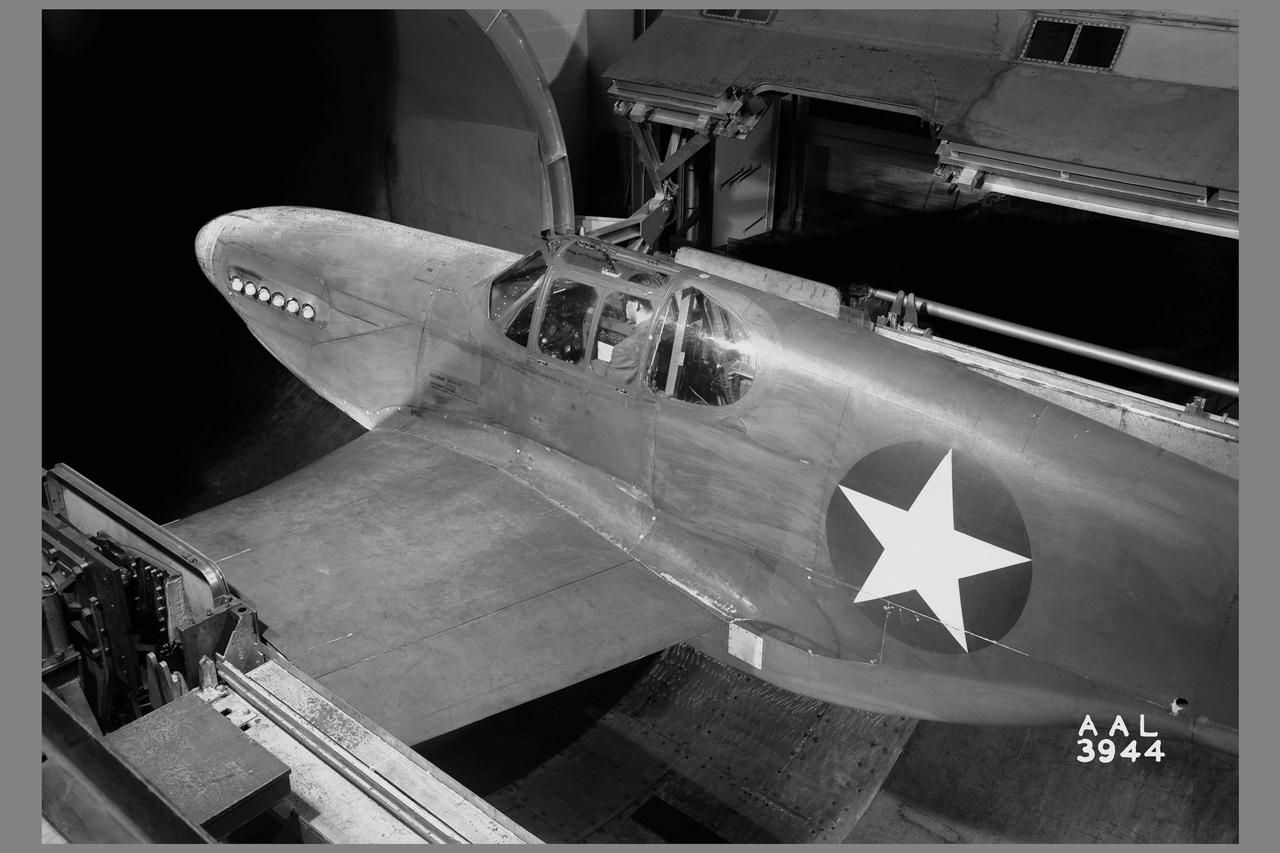 3/4 rear view of a XP-51B airplane mounted  in the 16ft w.t.  (Ames contribution to the solution of the duct-rumble problem)