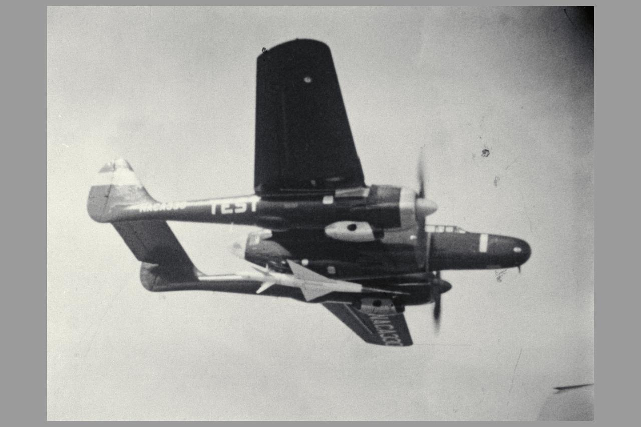 Photo by NACA 45 degree Sweptback wing model drop test Close-up of Body as it Leaves the Plane. Investigation of a Cambered and Twisted 45 degrees Swept-back Wing in the Transonic Range by the Recoverable-body Techniques.