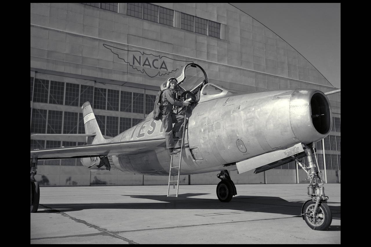 Ames Pilot George Cooper and F-84F airplane on ramp