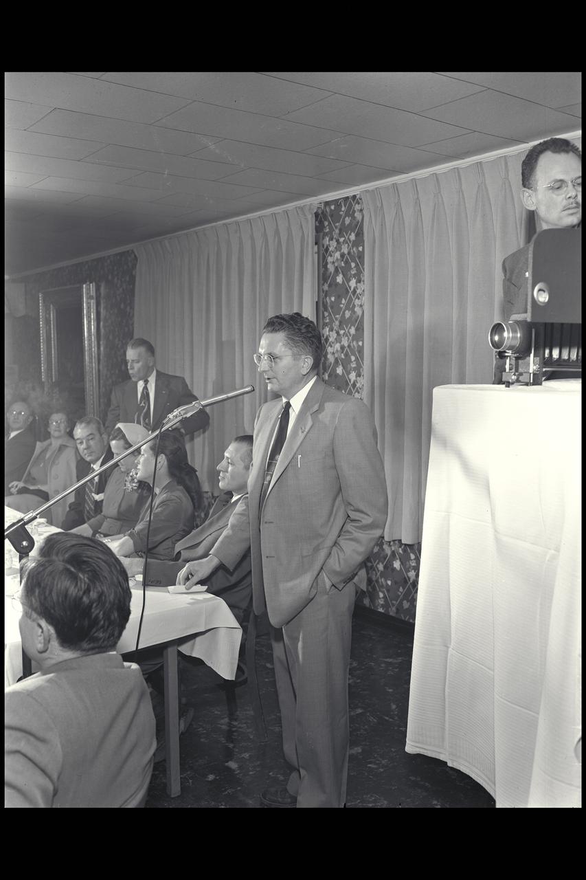 Harry J. Goett with Larry Clousing (seated next to him at head table) during William McAvoy (seat at middle of table) testimonial dinner.  Publication: Atmosphere of Freedom; 60 yrs. of Ames - NASA SP