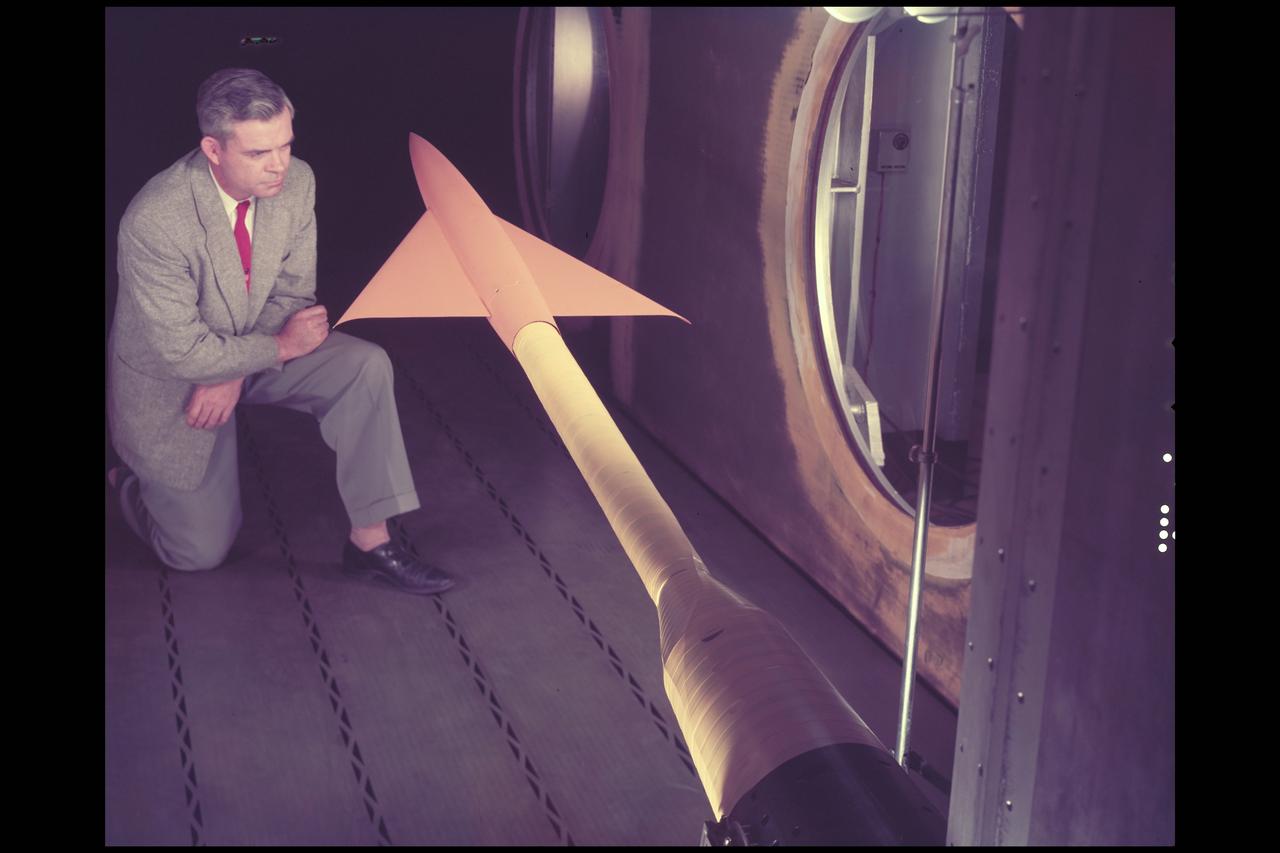 NACA Photographer Conical Cambered wing model in 14ft w.t. with Charles Hall