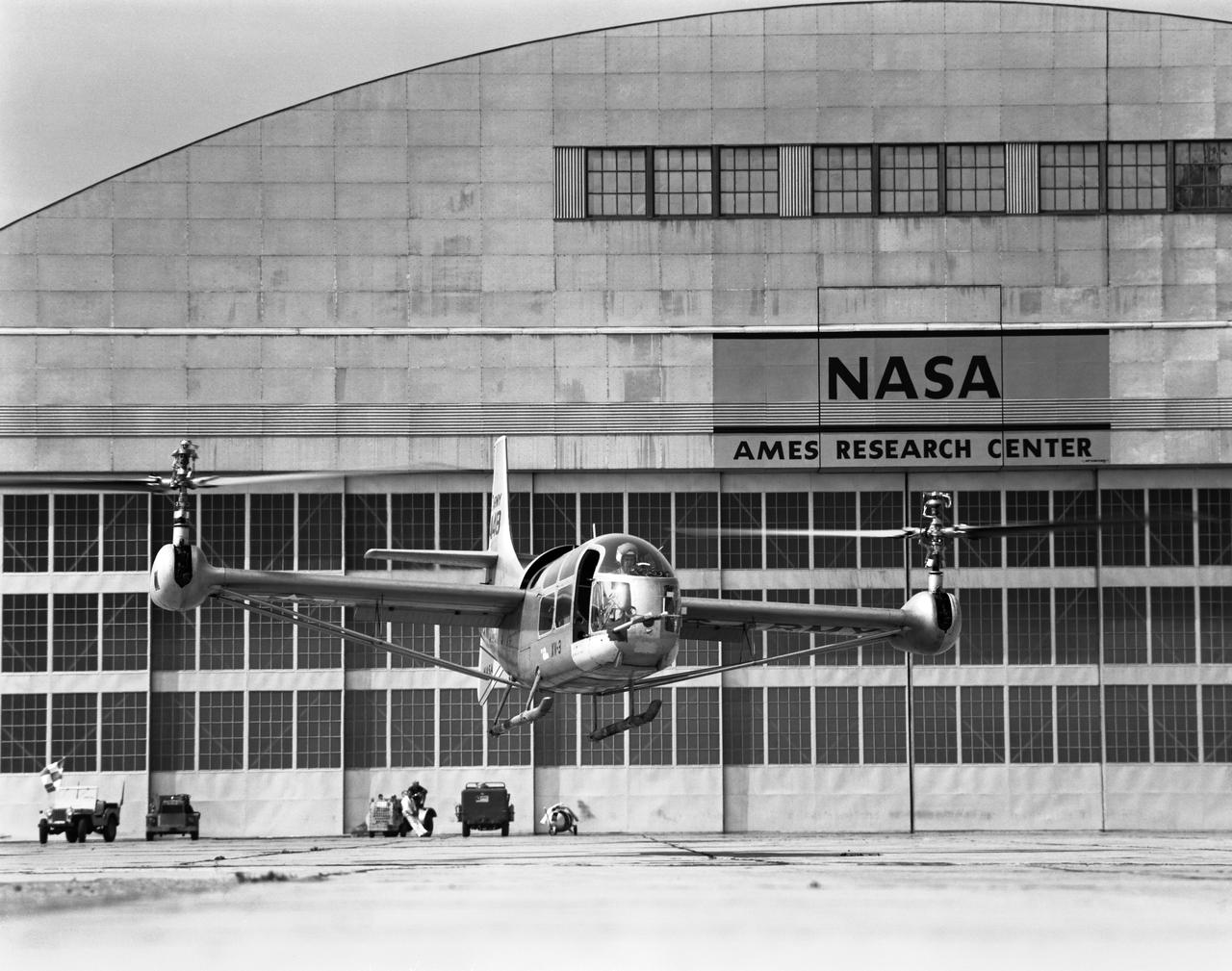 XV-3 airplane helicopter hovering VTOLin front of the NASA Ames Research Center, Moffett Field, CA hangar N-211