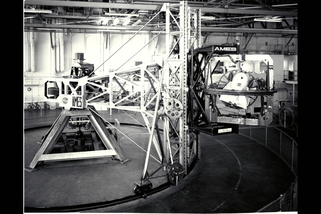 Ames 5 degrees-of-freedom motion simulator: This simulator incorporated a centrifuge of 30ft radius. The simulatored cockpit, located intn a hooded cab at the end of the centrifuge arm, was driven by motors, as required by the simulation, about each of its three axes (itch, roll, and yaw). The cab was also driven through a limited range of motion along the vertical axis and of course was driven by the centrifuge arm along a curved path of fixed radius in the horizontal plane. Thus the motions that could be simulated i the cab were three angular motions, one translational motion, and a curvilinear combination of the remaining two translational motions. The curvilinear motions, and associated accelerations, were, of course, fairly representative of airplane flight. The simulator was placed in operation early in 1961.   ref: Adventures in Research (pg 341/341) NASA SP-4302