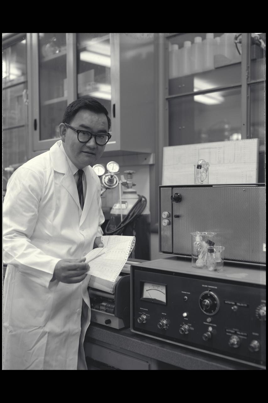 Vance I. Oyama at the Gas Chromatograph in Ames' life detection laboratory, Vance and his brother Jiro both pioneered new areas of life sciences research at Ames.   Publication: Ames History; Atmosphere of Freedom; 60 yrs at NASA Ames NASA SP-2000-4314