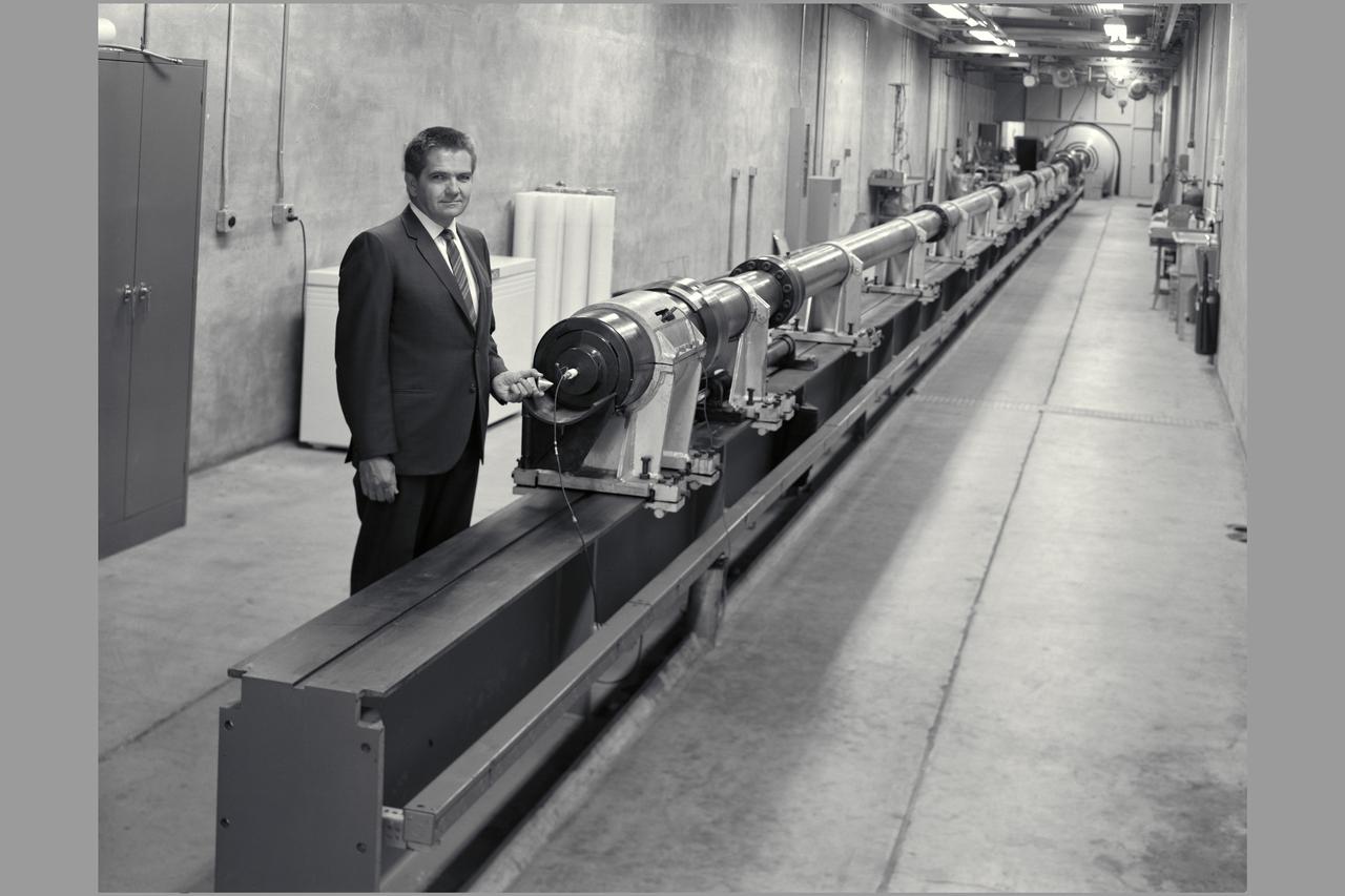 Thomas N. Canning, Hypersonic Free-Flight Branch Chief, holds model that is fired down range in gun. Hypersonic Free-Flight Gun.