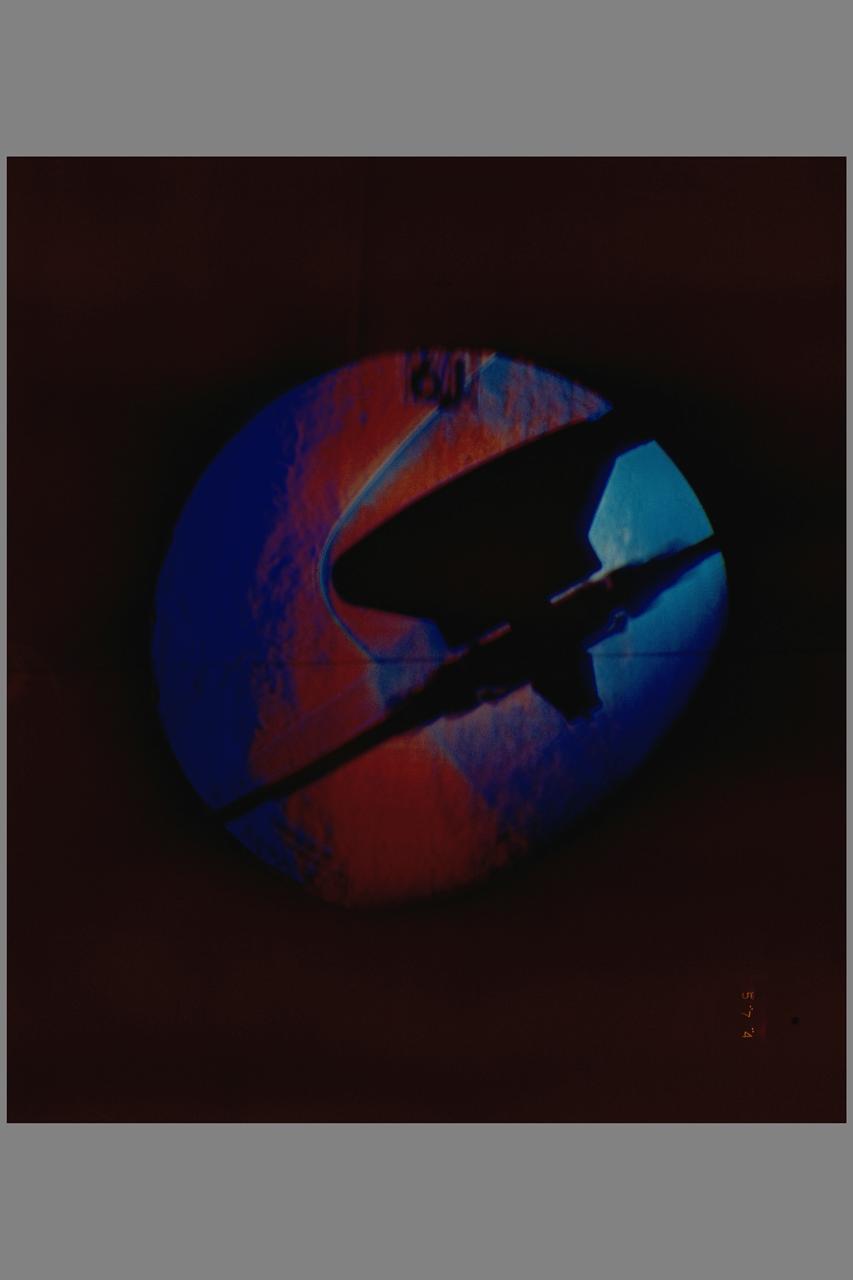 Aerodynamic Characteristics of Rotary Entry Vehicle configuration REV-1 model schlieren. Testing being done at the NASA Ames Research Center, California
