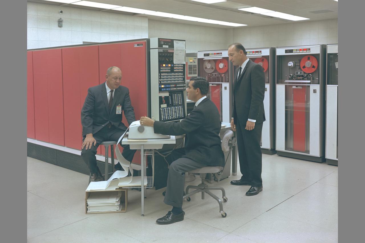 MR. A. NATWICK, MR. T. GONZALES, MR. F. GIALLANZA, AT WORK IN THE 7094 COMPUTER ROOM OF THE PIONEER TAPE PROCESSING STATION AT NASA AMES RESEARCH CENTER.  Pioneer Off-Line Data Processing System.