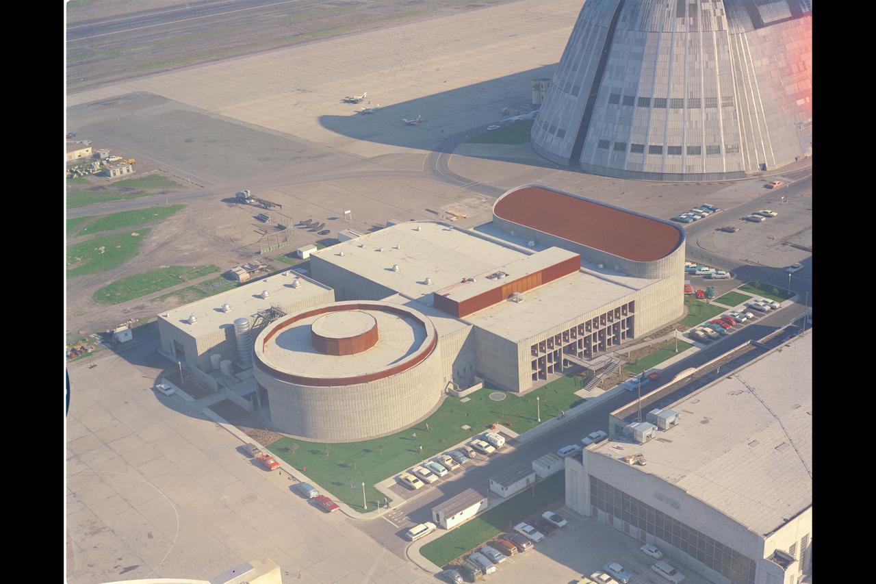 Aerial Survey of Ames Research Center - Flight Simulation Complex'  Flight simulators create an authentic aircraft environment by generating the appropriate physical cues that provide the sensations of flight.