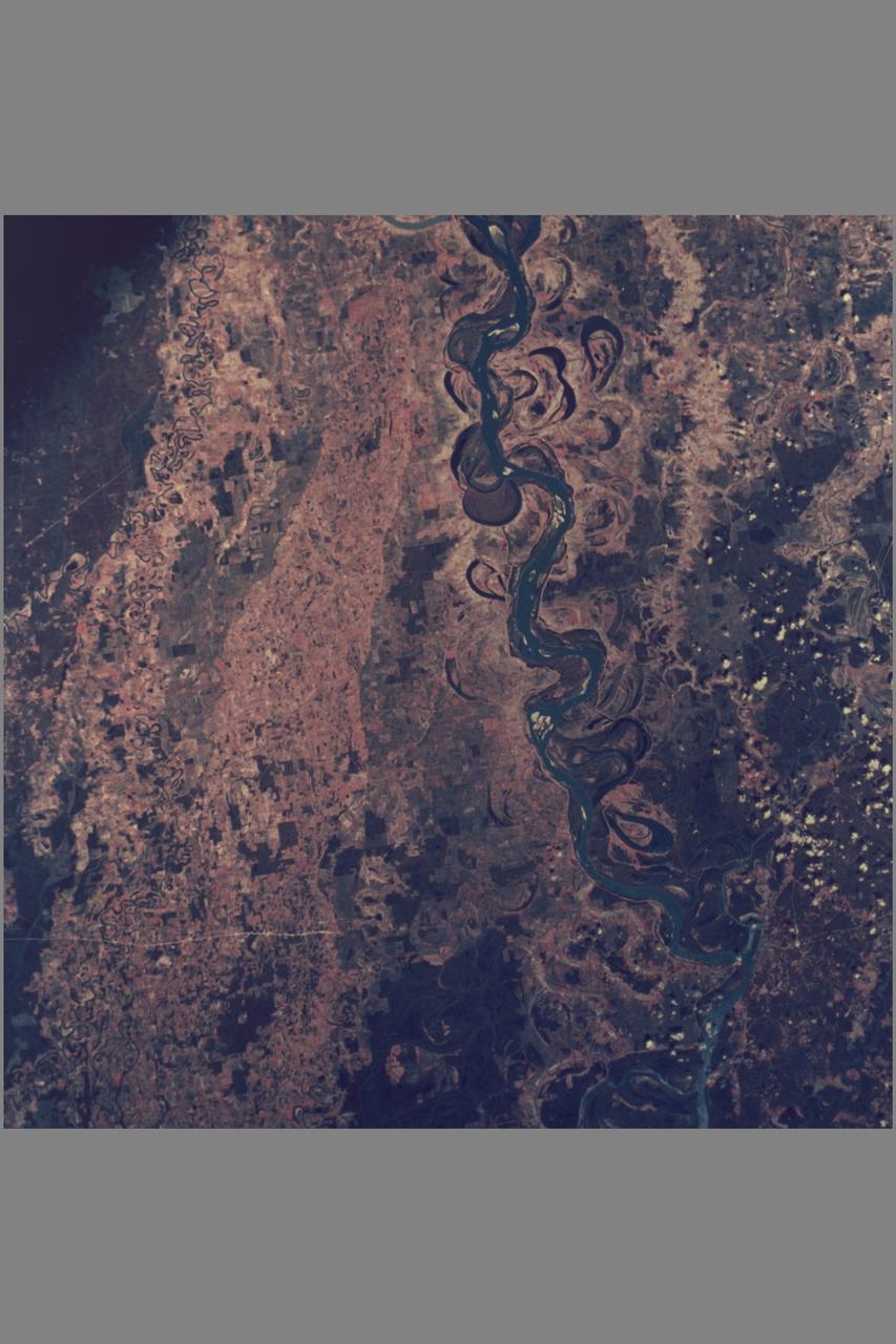 Apollo 9 This infrared color photograph of the Mississippi Valley area was taken by the four synchronized cameras in the Earth Resources Survey SO65 experiment. Shown in this picture are Vicksburg and Greenville Bend. At 1:08 p.m. EST when this photo was made, the Apollo spacecraft was at an altitude of 105 nautical miles and the Sun elevation was 55 degrees above the horizon. Location of the point on the Earth's surface at which the four-camera combination was aimed was 32 degrees 41 minutes North latitude and 91 degrees 13 minutes West longitude.