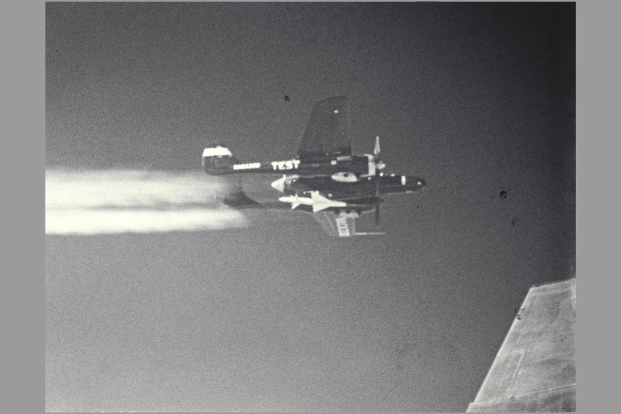 NACA Photographer (DFRC) ERF-61C-1-NO (AAF43-8330 NACA 330, NACA 111) mother ship for RECOVERABLE-BODY TECHNIQUE.  Transonic Model Testing.  Fig. 13  NASA SP-1998-3300 Flight Research at Ames: 57 Years of Development and Validation of Aeronautical Technology