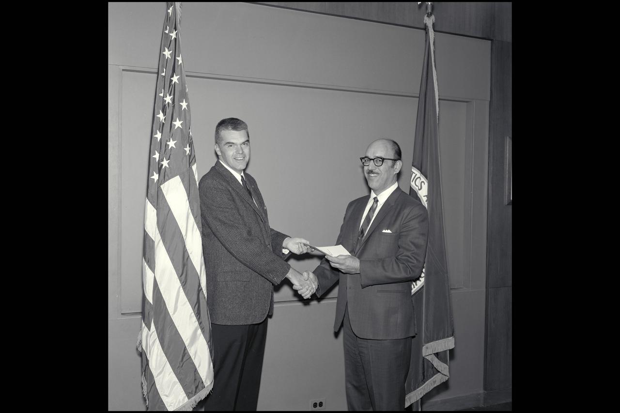 Dr Hans Mark presents Patent award to John Dimeff