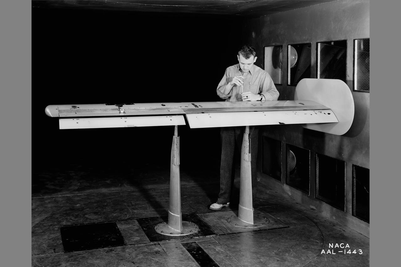 XB-32 model wing with 15% chord sealed gap aileron. Flaps extended to 40 degrees. The first wind-tunnel report published by Ames Covered the XB-32 Test in the 7-by-10 No. ! and was authored by Roy P. Jackson and George L. Smith Jr.