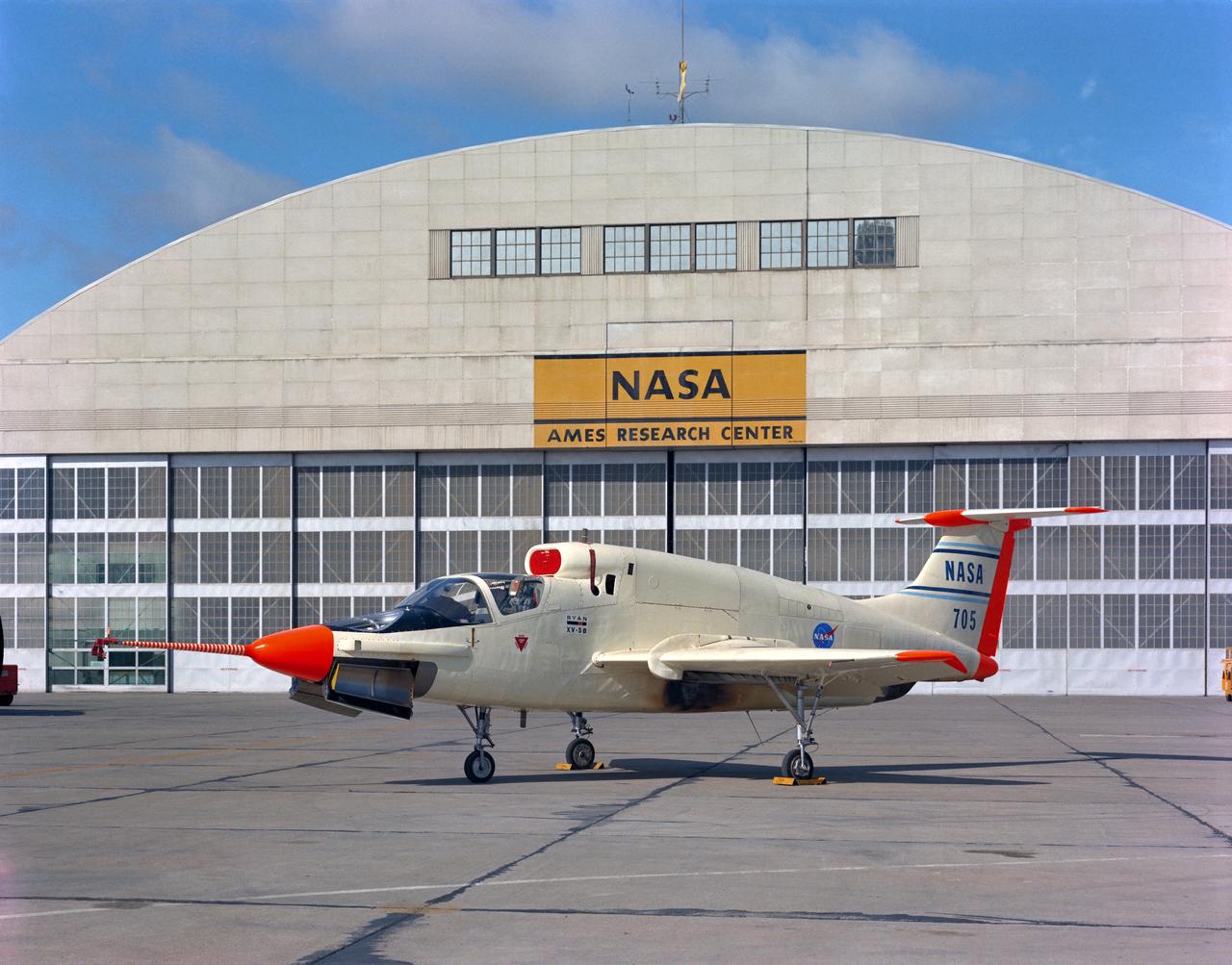 XV-5B (NASA-705) on Flight Line at Ames Research Center with hangar in the background.