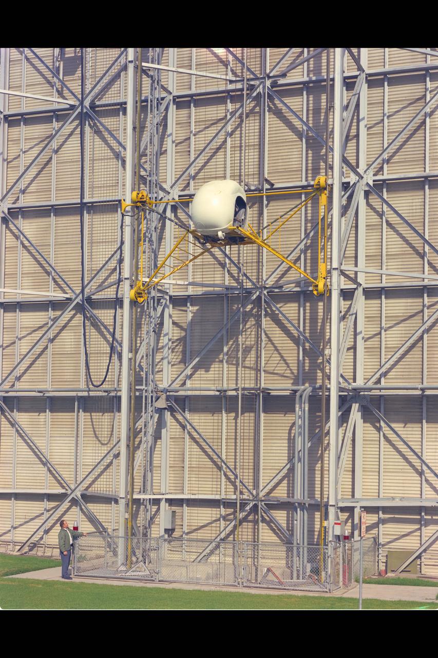 Height-Control Test Apparatus (HICONTA) Simulator mounted to the exterior of the 40x80ft W.T.  Building N-221B and provided extensive vertical motion simulating airplanes, helicopter and V/STOL aircraft