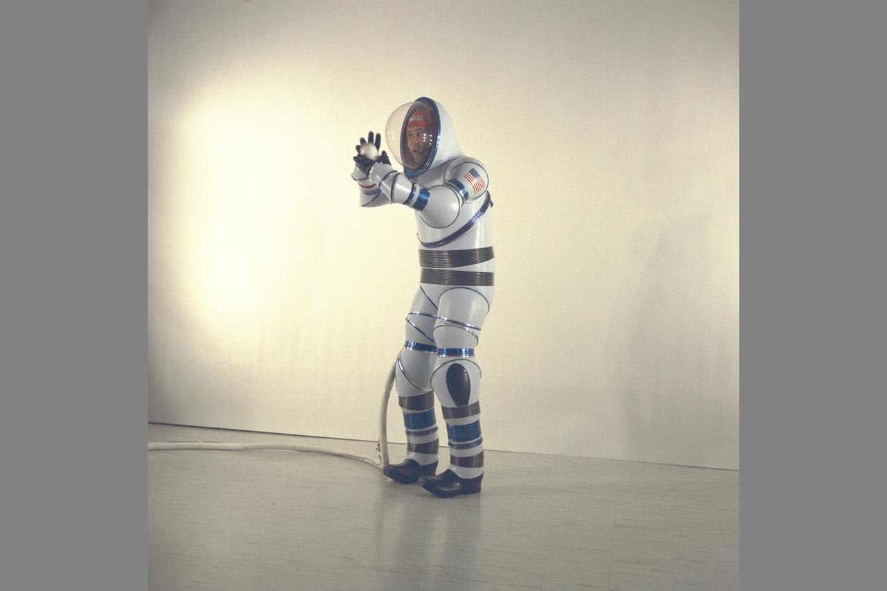 AX-2 Hard Space Suit with Vic Vykukal getting ready to pitch a baseball. Vykukal is the principal investigator of the AX space suit series.