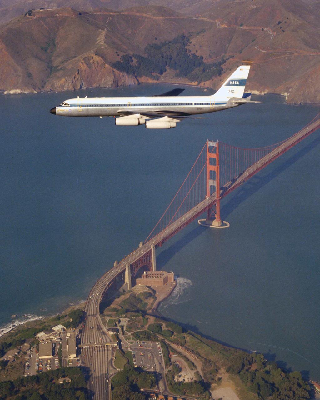 CV-990 (NASA-712) Galileo II aircraft in flight over the San Francisco's Golden Gate Bridge. A digital navigation, guidance and autopilot system tested on Galileo 1 and Galileo II in 1975 looked at the feasibility of energy-management approach concepts for an unpowered vehicle. Flight tests carried out by pilot Fred Drinkwater with technical direction by Fred Edwards and John D Foster along with significant input from Gordon Hardy on the pilot's system interface. Note:  Used in publication in Flight Research at Ames;  57 Years of Development and Validation of Aeronautical Technology NASA SP-1998-3300 fig 95 ref 99