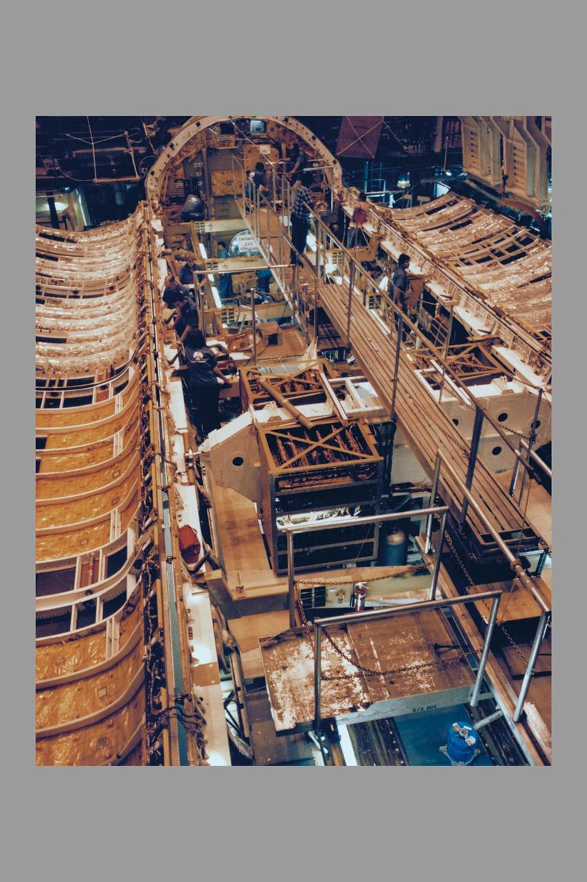 The payload bay doors of the Space Shuttle Orbiter Columbia were opened for the first time today using the orbiter's onboard door operation system. The hinges of the payload bay doors are not designed to support the weight of the doors while open horizontally in the Earth's one 'g' environment and a counterweight zero 'g' device supports the weight of the doors while they are open for processing in the OPF.