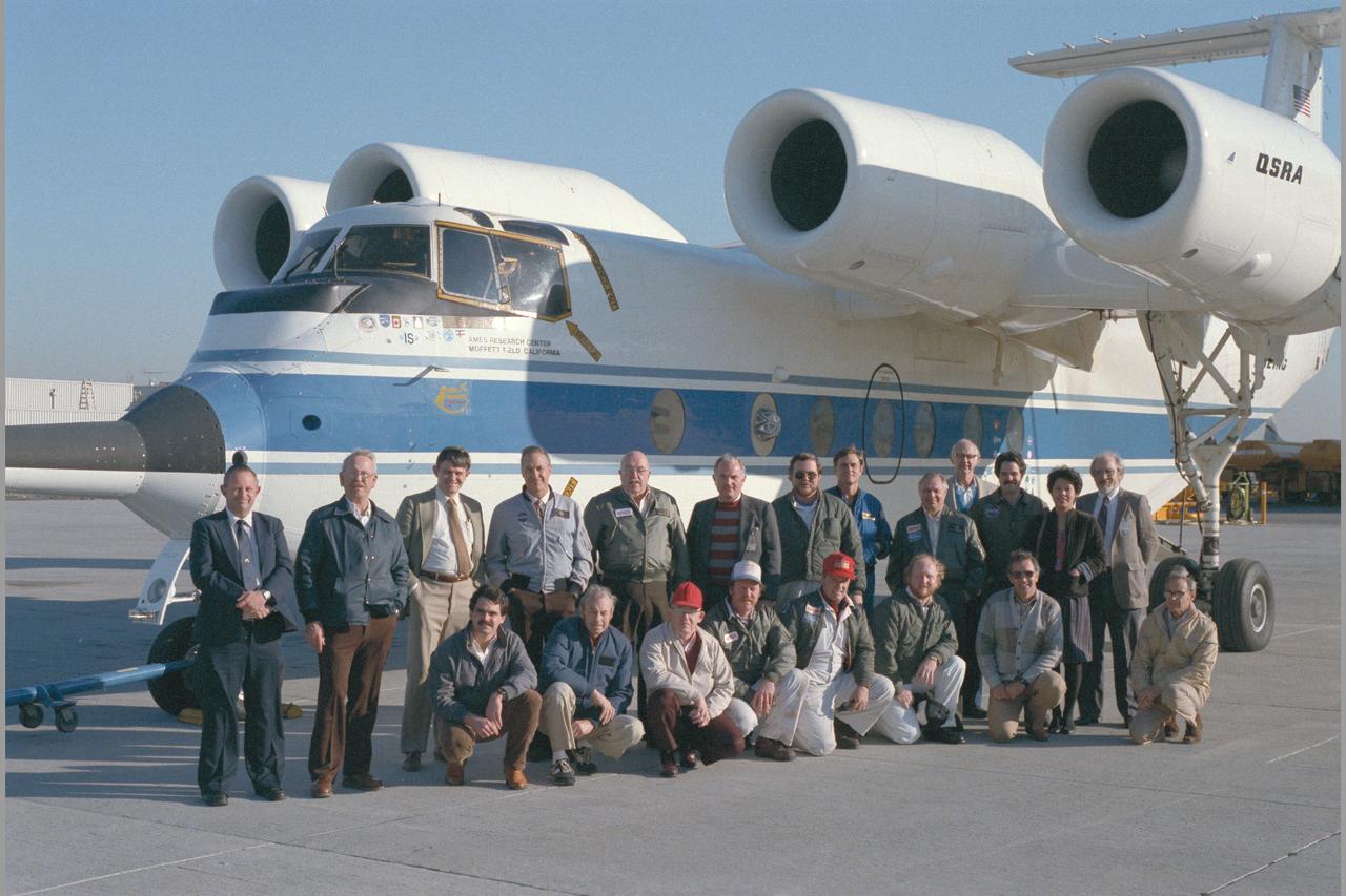QSRA (NASA 715) 400TH FLIGHT PARTICIPANTS. L-R: front row: Jim Ahlman, Bob Innis, Del Watson, Jim Lesko, Lee Mountz, Mike Herschel, Tom Kaisersatt, Jack Stephenson, Back row: Dennis Riddle, Neis Watz, Jack Franklin, Gordon Hardy, Bob Hinds, Charlie Hynes, Richard Young, Jim Martin, Joe Eppel, John White, Bob America, Hien Tran, Bill Bjorkman. Note:  Used in publication in Flight Research at Ames;  57 Years of Development and Validation of Aeronautical Technology NASA SP-1998-3300 fig. 112
